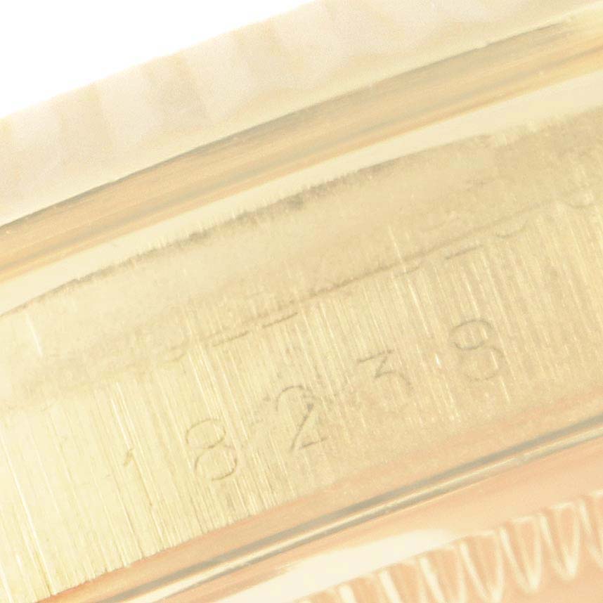 This image shows a close-up of the serial number engraving on the case of a Rolex President 18238 Men
s Yellow Gold Champagne Dial 18238 Men
s Yellow Gold Champagne Dial model watch.