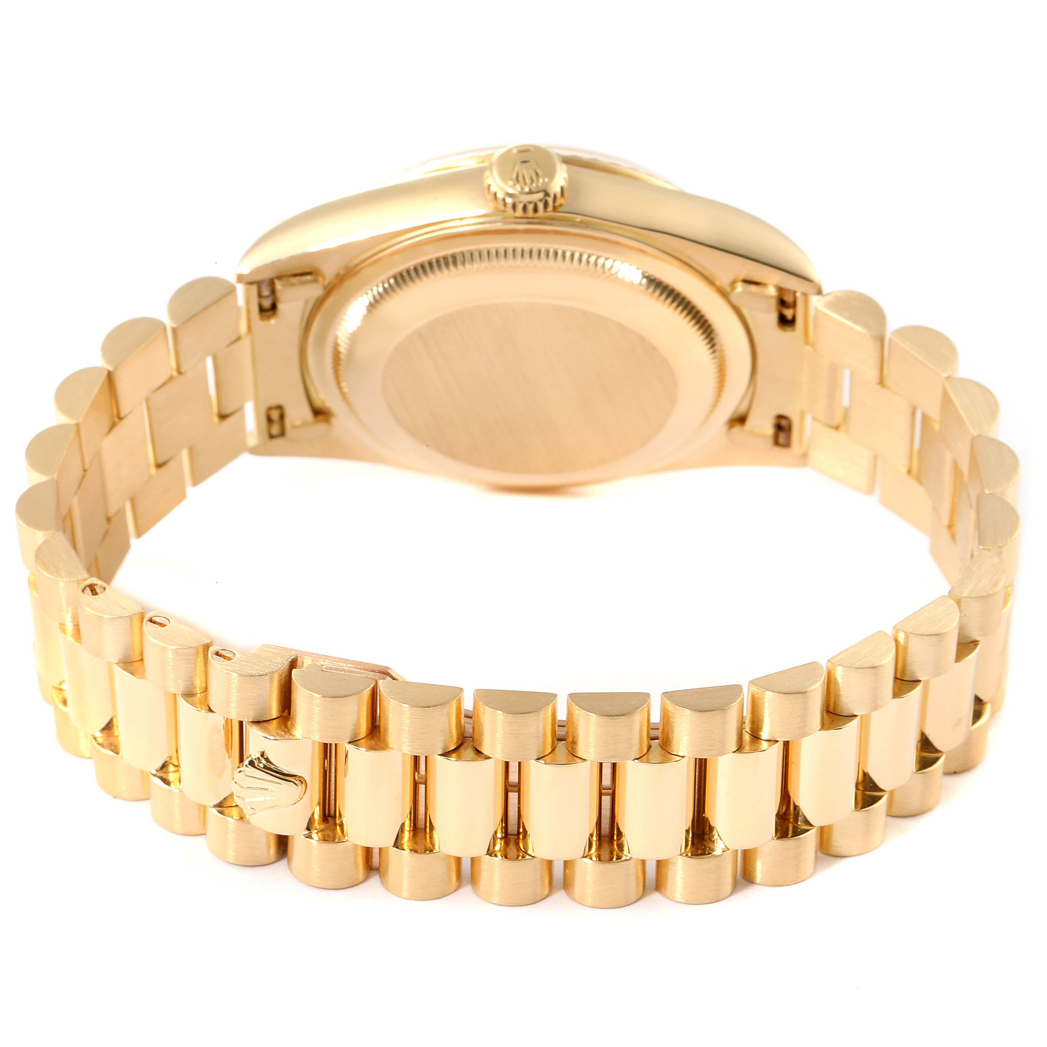 The Rolex President 18238 Men
s Yellow Gold Champagne Dial 18238 Men
s Yellow Gold Champagne Dial model watch is shown from the rear, highlighting the gold bracelet and the case back.