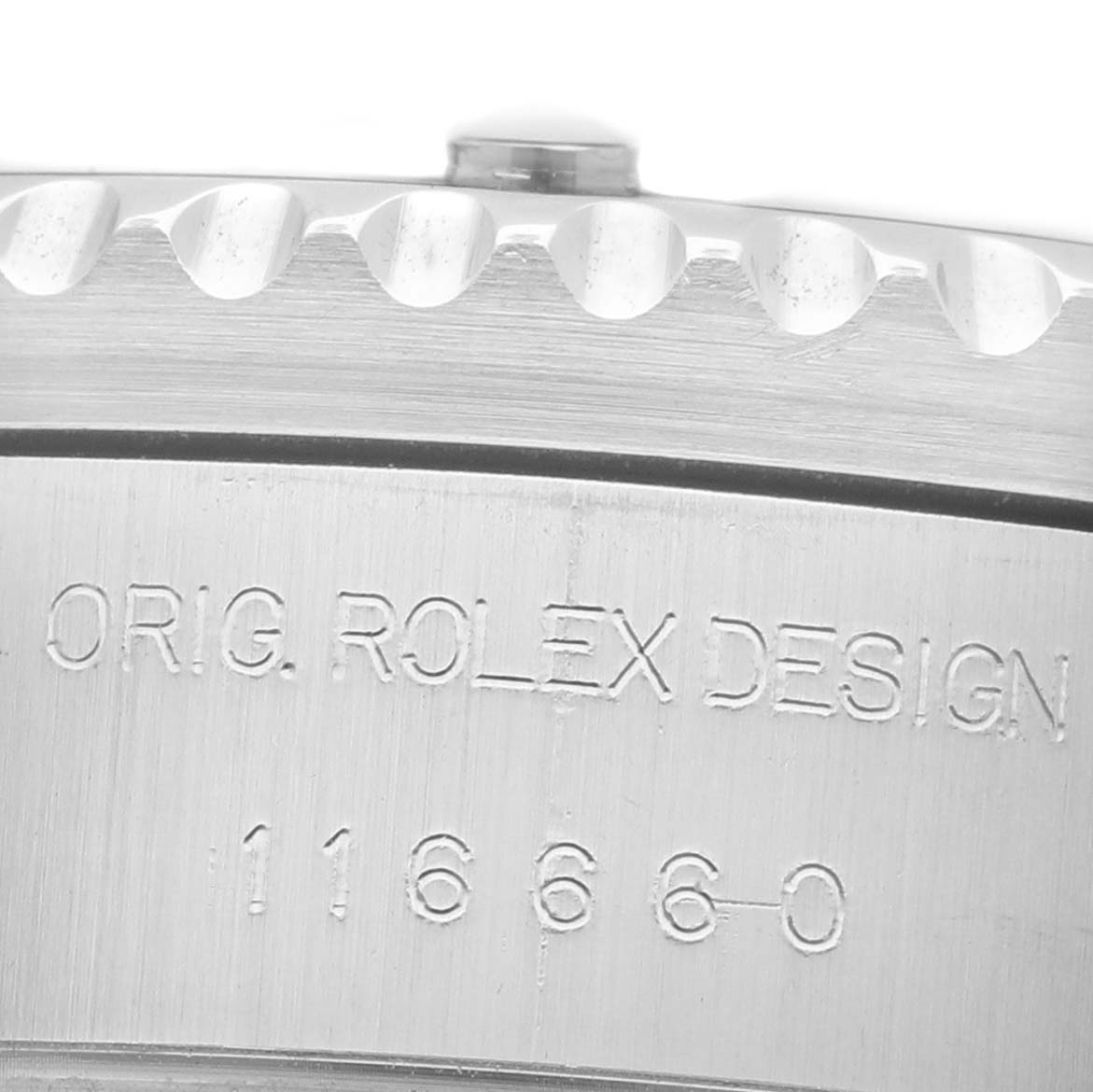The image shows a close-up of the side engraving on a Rolex Sea-Dweller 116660 Men's Stainless Steel Black Dial, with "Orig. Rolex Design 116660" visible.