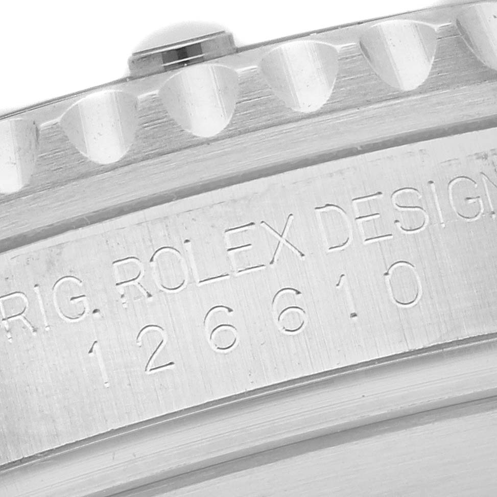 Close-up view of the engraved serial number and part of the bezel of a Rolex Submariner 126610LN Men's Stainless Steel Black Dial 126610LN Men's Stainless Steel Black Dial model 126610.