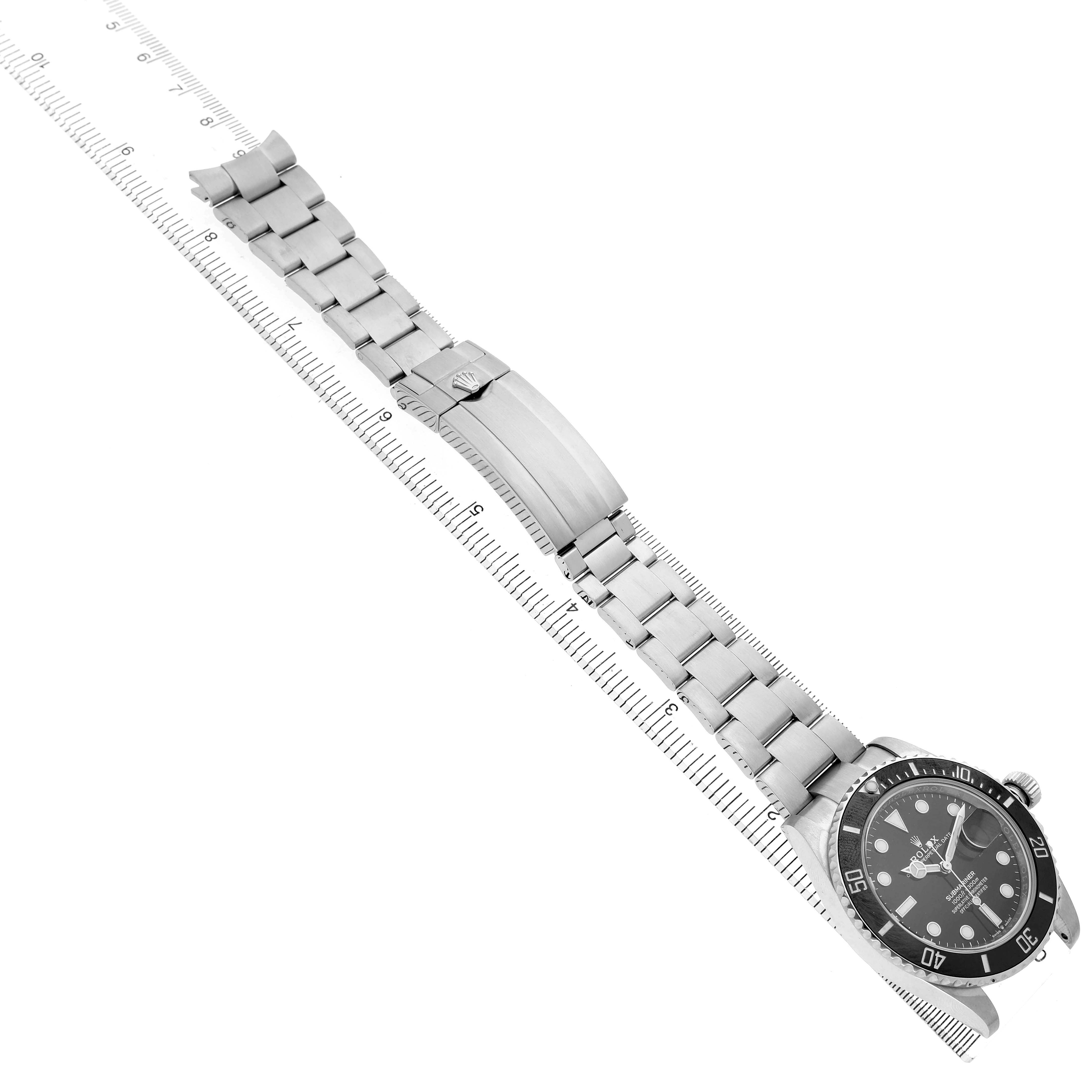The image shows a diagonal top view of a Rolex Submariner 126610 Men's Stainless Steel Black Dial, highlighting the watch face, bezel, and bracelet.