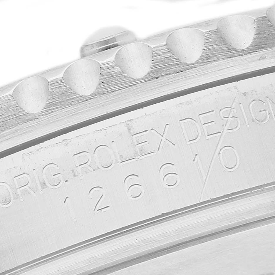 The image shows the engraved edge and side of a Rolex Submariner 126610 Men's Stainless Steel Black Dial bezel with model details.
