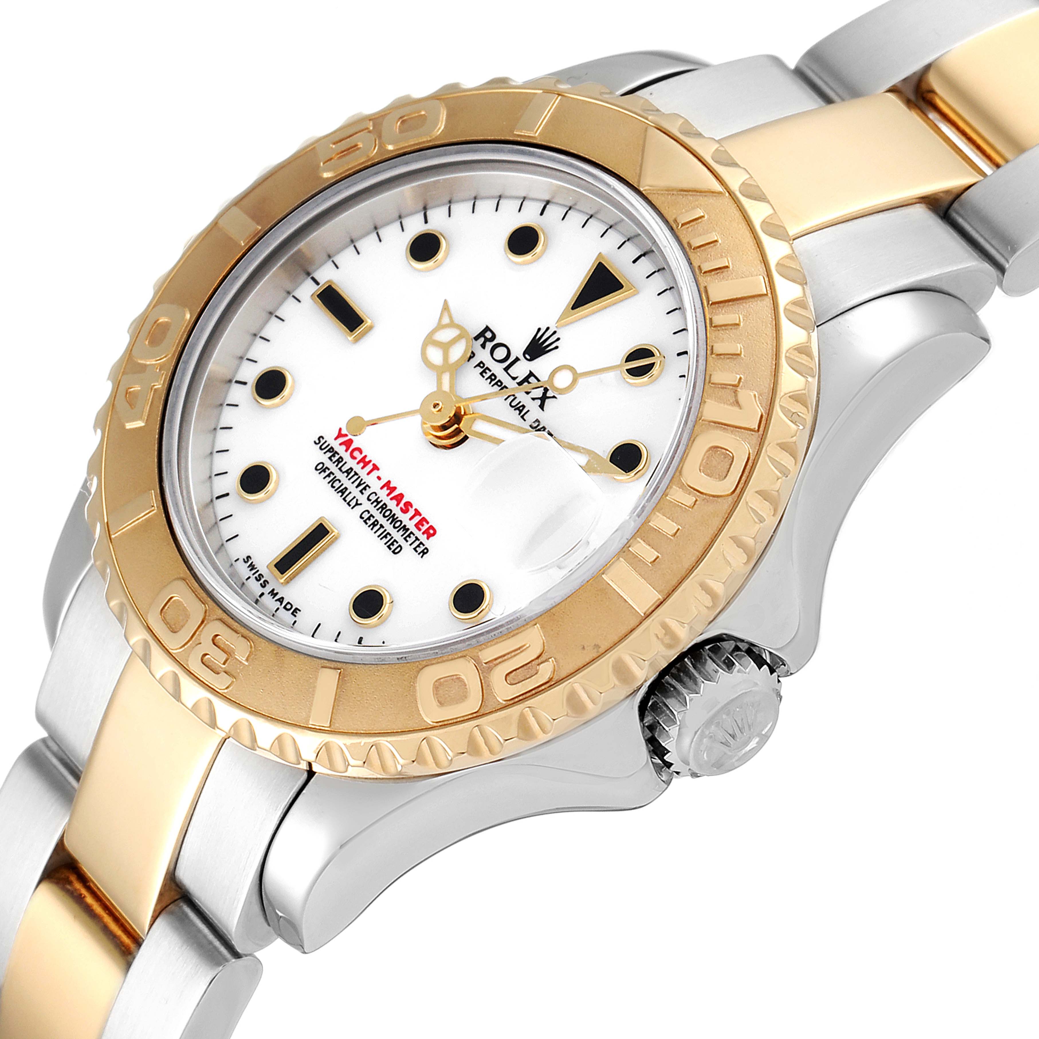 The image shows a close-up of the Rolex Yacht-Master 169623 Women's Steel and Gold (two tone) White Dial 169623 Women's Steel and Gold (two tone) White Dial watch face, bezel, crown, and part of the bracelet at a slight angle.