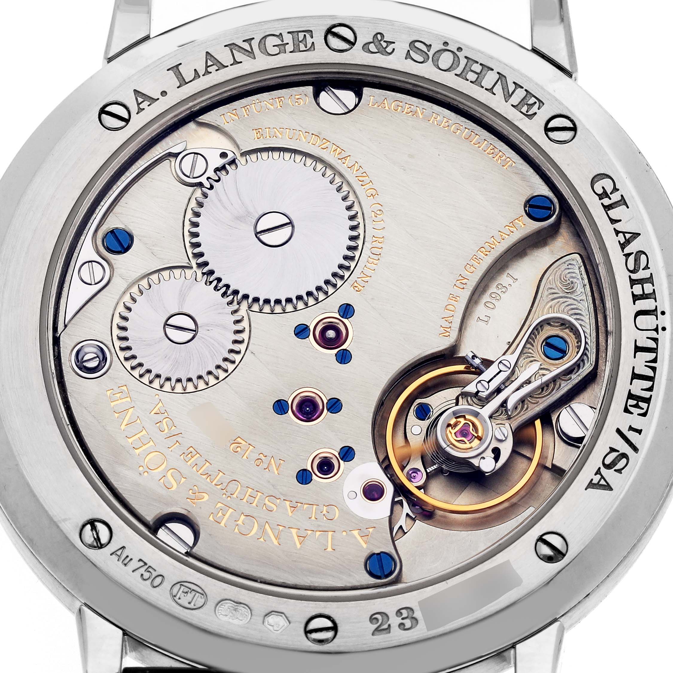 The image shows the case back of an A. Lange & Söhne Saxonia model 201.027 men's watch, exposing its intricate mechanical movement and decorative elements.
