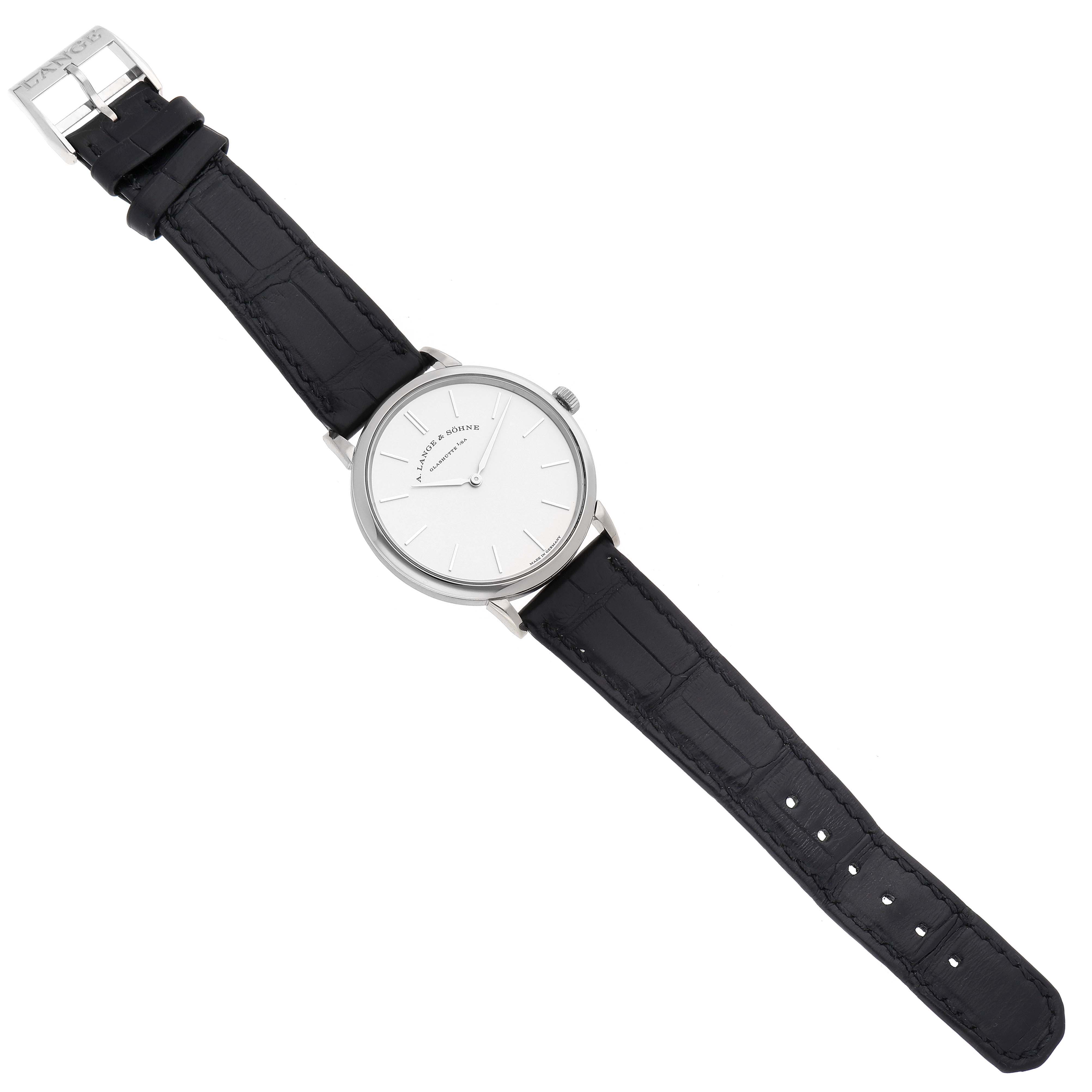 The A. Lange & Söhne Saxonia model 201.027 men's watch is shown from a top-down angle, displaying the dial, case, strap, and buckle.