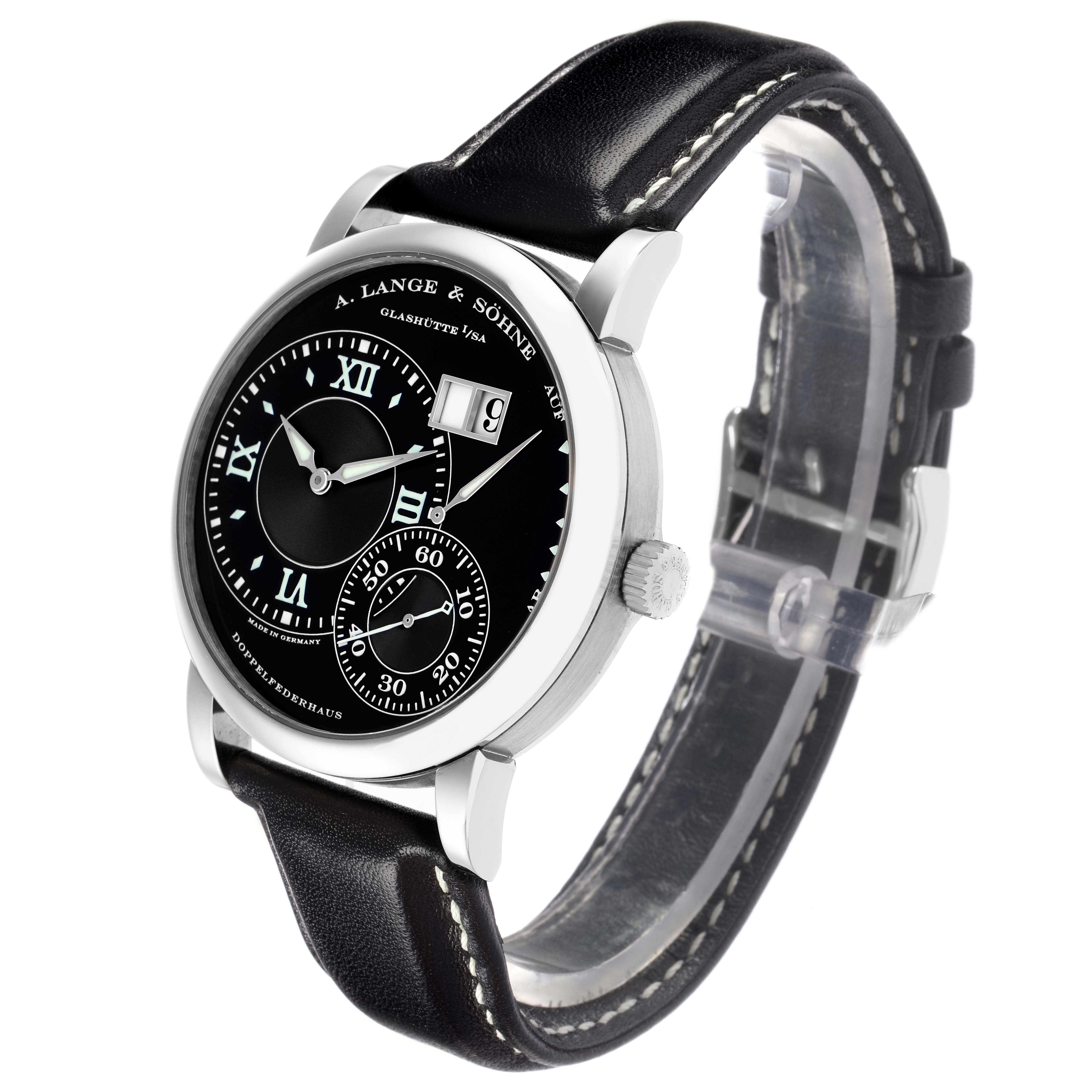 The A. Lange & Söhne Lange 1 model 115.029 men's watch is shown at a slight side angle, highlighting the black dial, Roman numerals, sub-dial, date window, and leather strap.