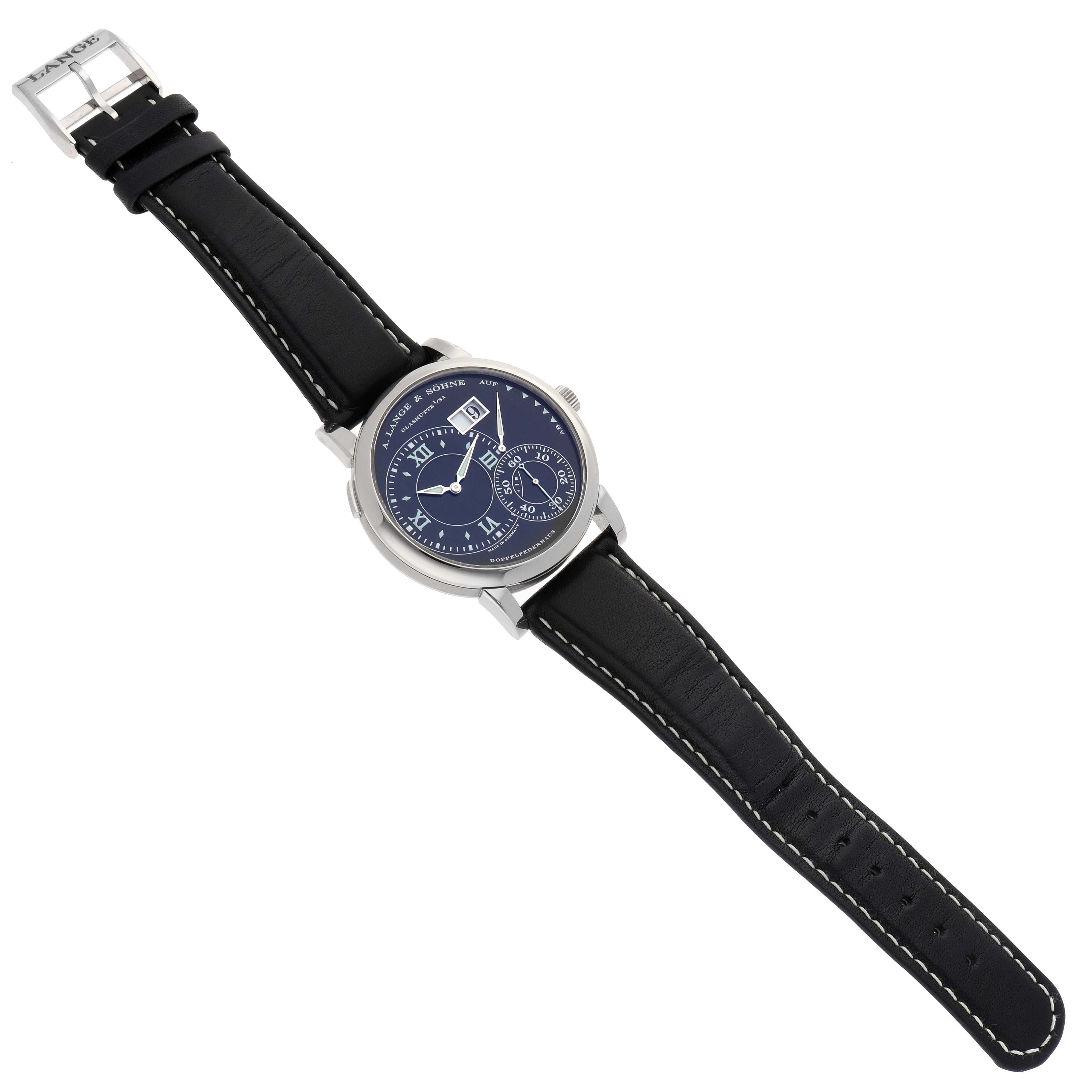 The A. Lange & Söhne Lange 1 model 115.029 men's watch is shown from a top-down angle, displaying the face, case, and full leather strap with a visible buckle.