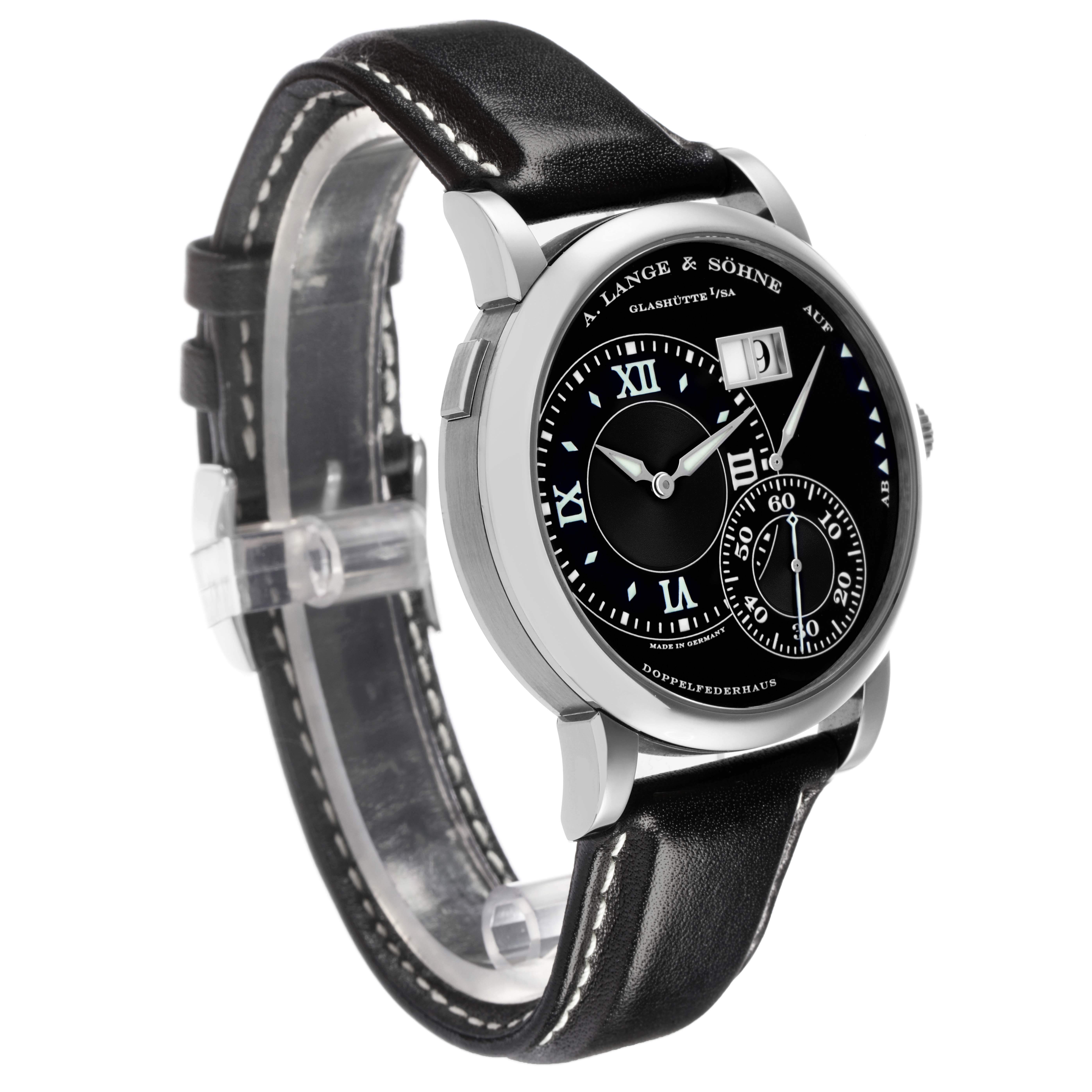 The image shows an A. Lange & Söhne Lange 1, model number 115.029, from a side angle highlighting the black dial, case, and leather strap.