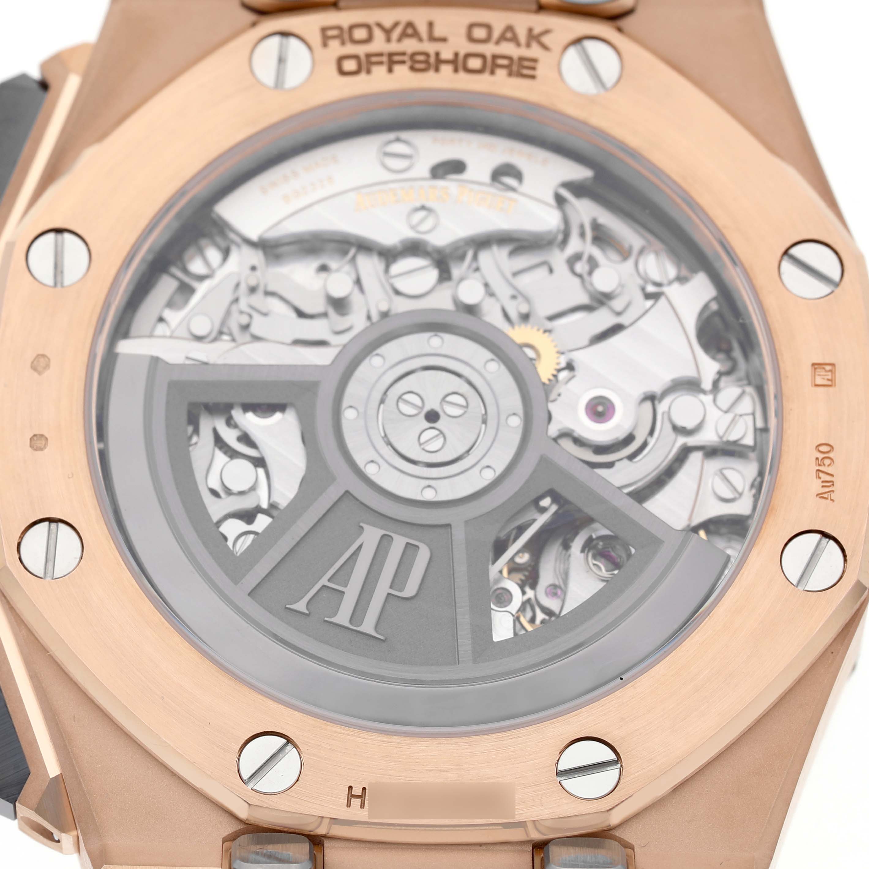 The image shows the back view of an Audemars Piguet Royal Oak Offshore 26420RO.OO.A002CA.01 Men's Rose Gold Black Dial watch, highlighting its visible movement and rotor.