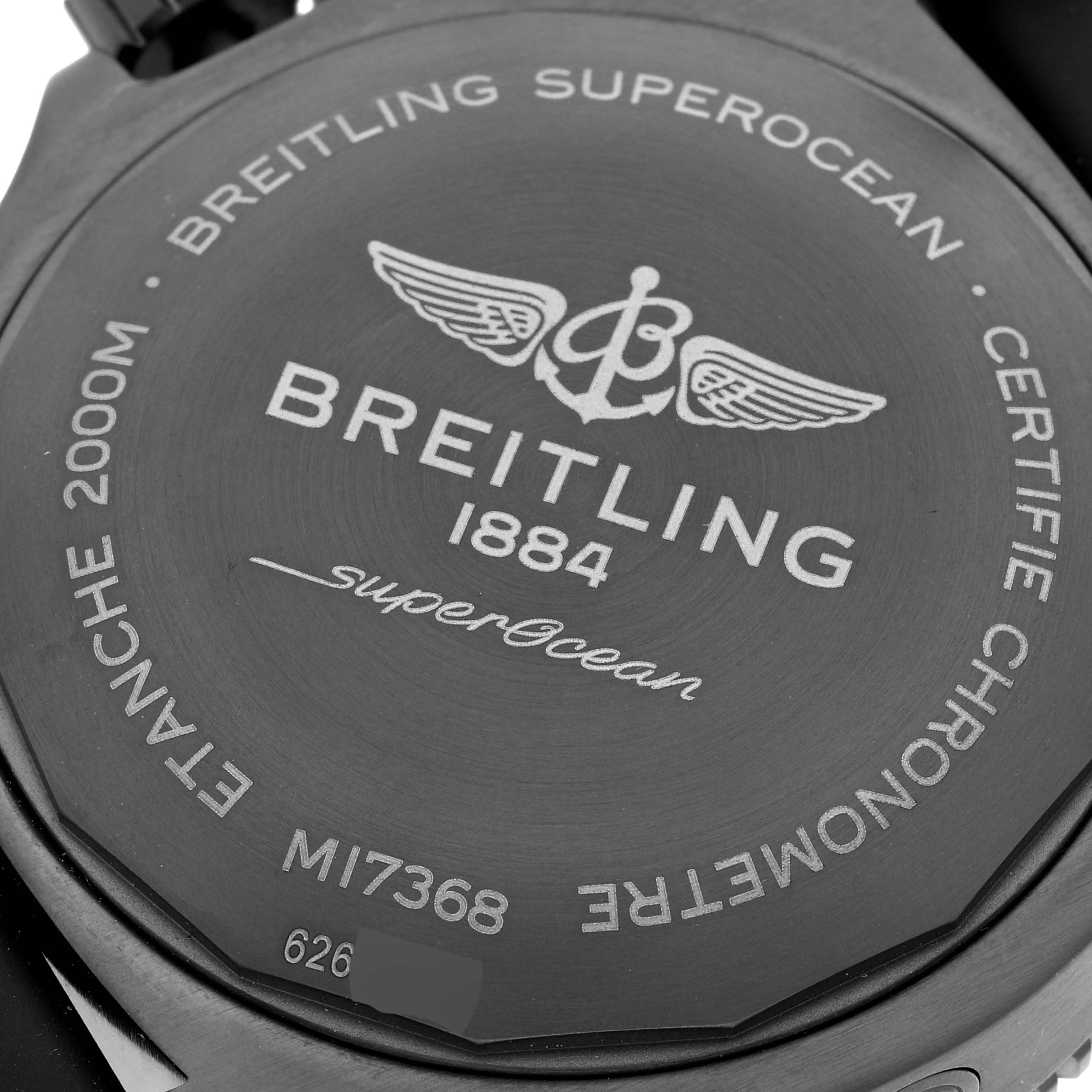 This image shows the back case of a Breitling Superocean M17368 Men's Stainless Steel Black Dial M17368 Men's Stainless Steel Black Dial watch, highlighting brand engravings and model details.
