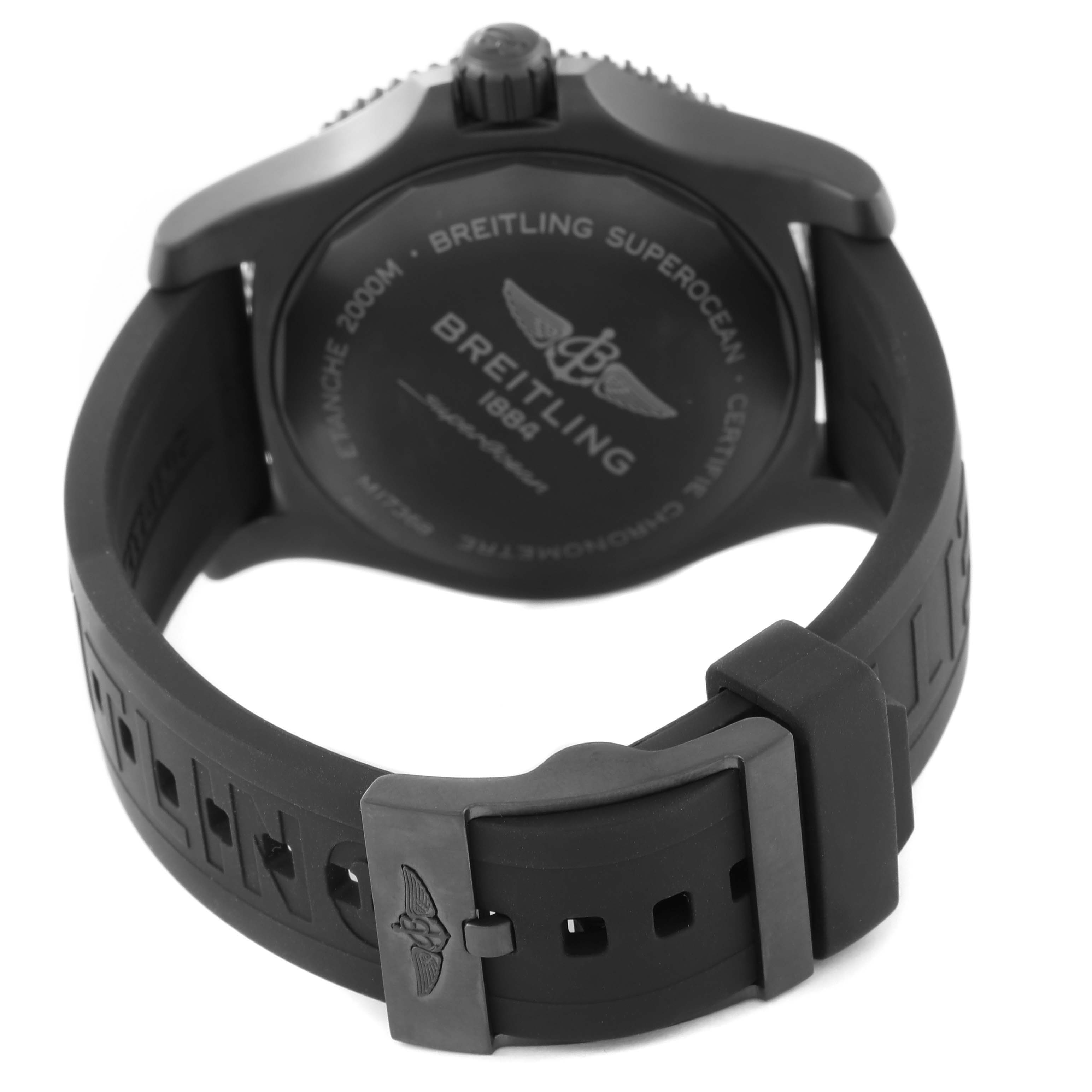 The image shows the backside of the Breitling Superocean M17368 Men's Stainless Steel Black Dial M17368 Men's Stainless Steel Black Dial watch, focusing on the case back and rubber strap with buckle.