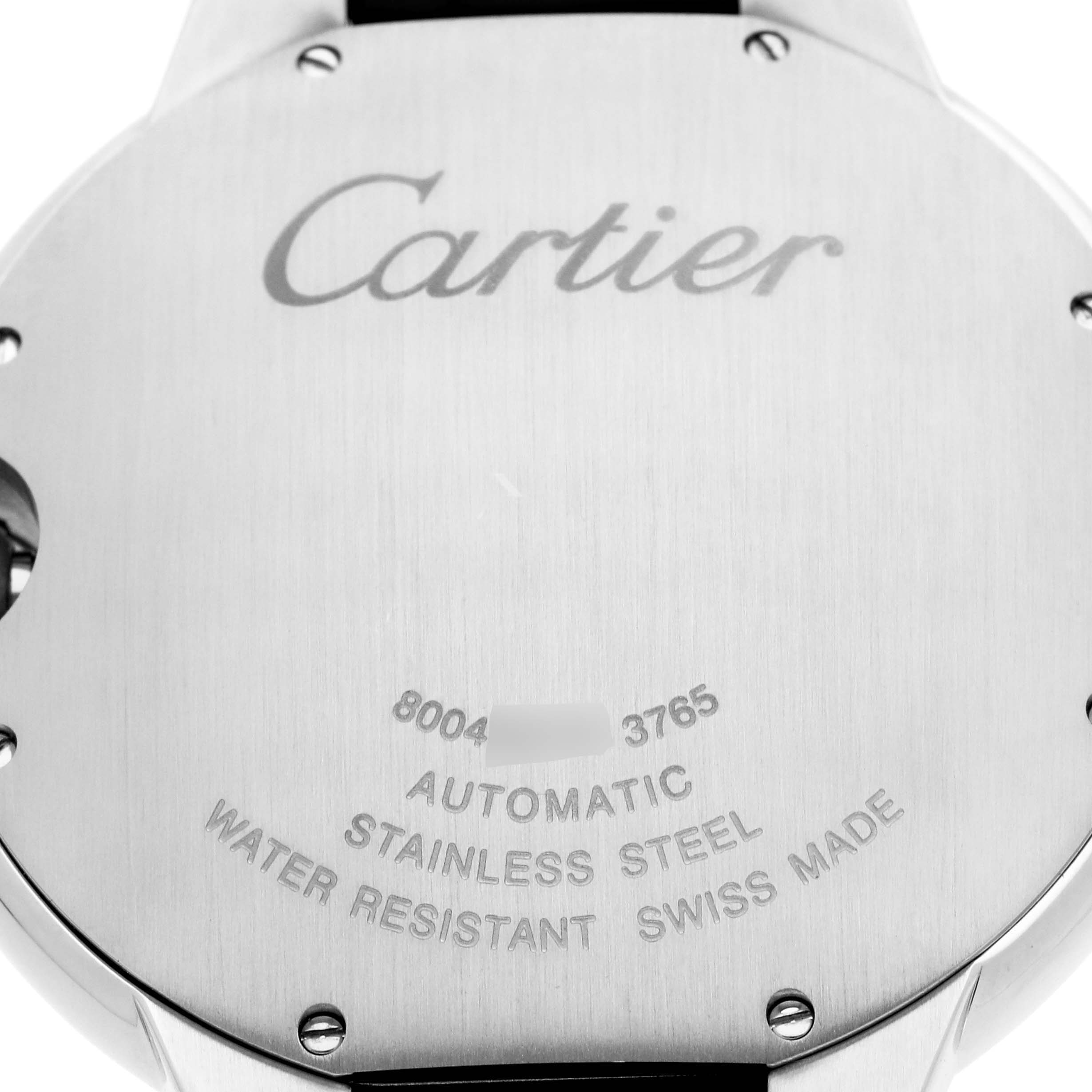 The image shows the back casing of the Cartier Ballon Bleu watch, model WSBB0027, featuring engraved text about its automatic movement, material, and Swiss craftsmanship.