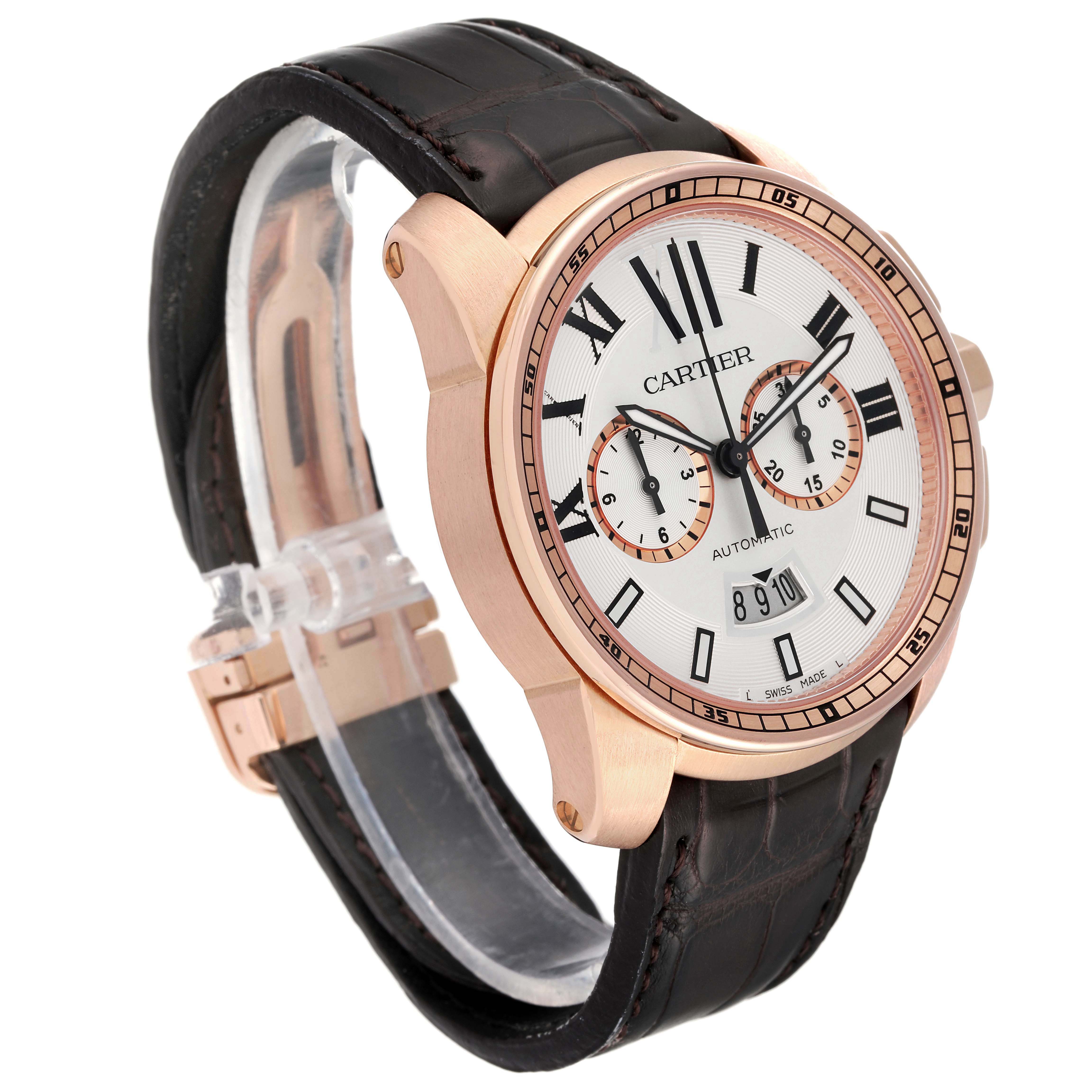 The Calibre de Cartier watch is shown at an angle displaying the face, bezel, crown, and part of the leather strap.