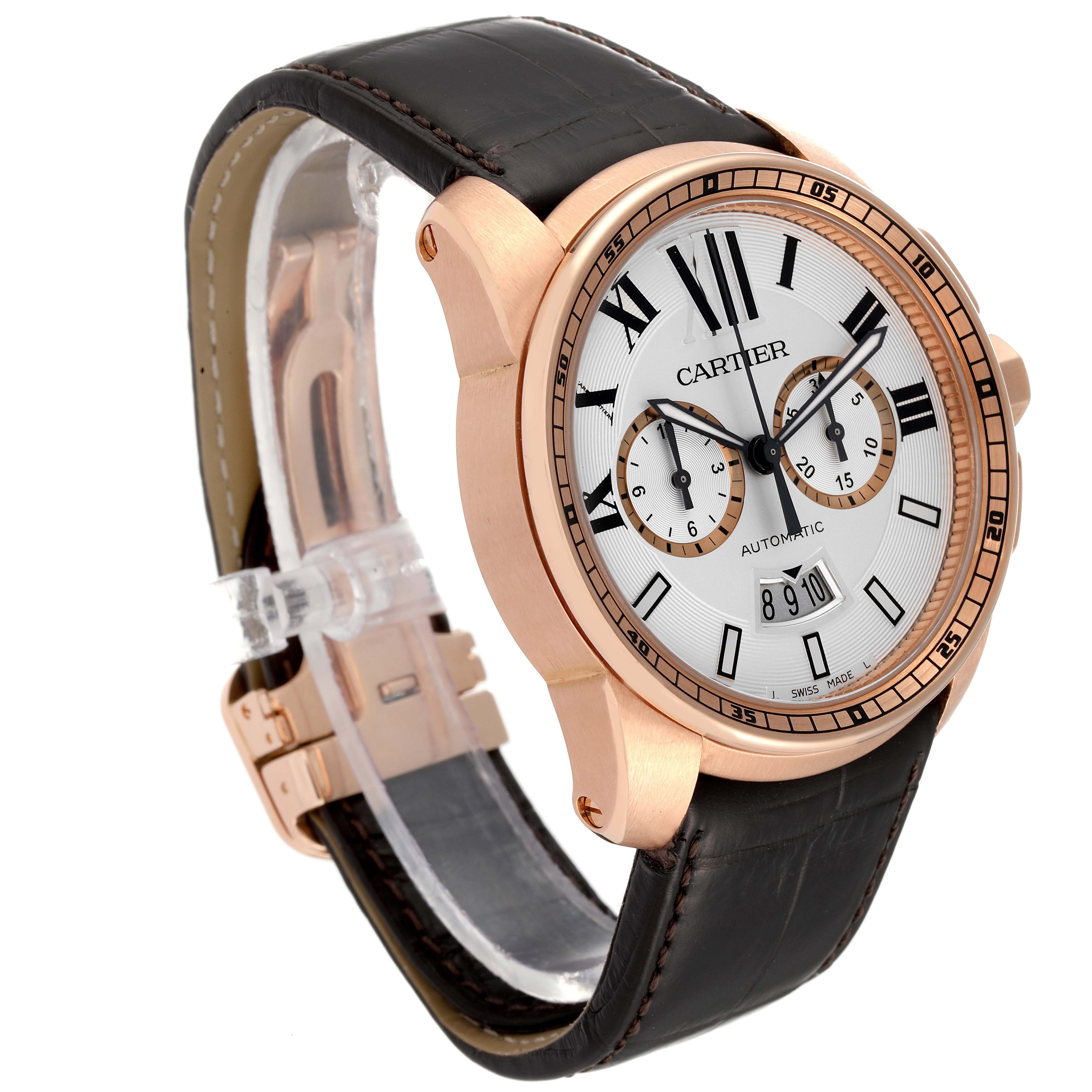 The Calibre de Cartier watch is shown from a front-left angle, displaying its face, leather strap, and gold case.
