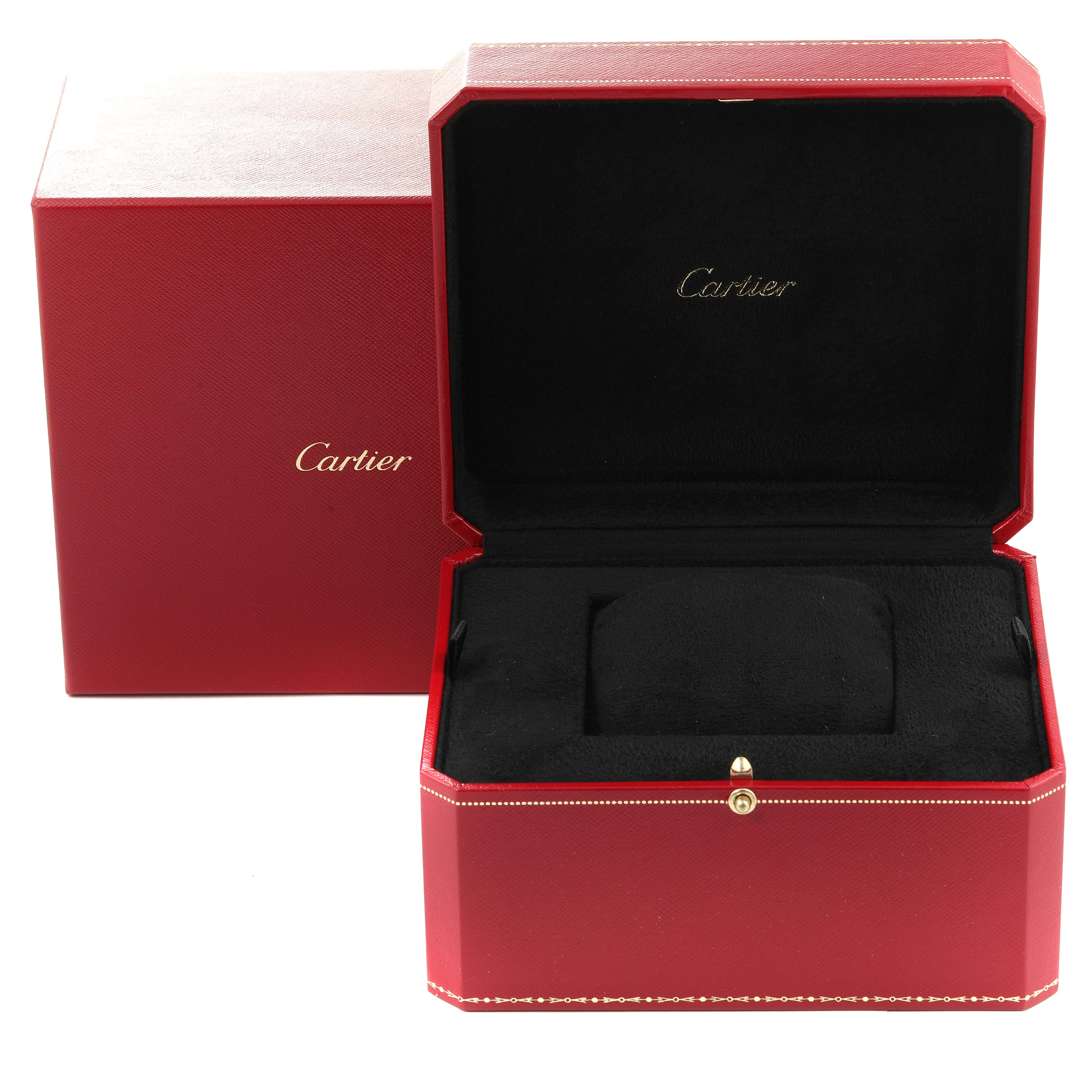 This image shows the open red box and outer case for a Drive de Cartier watch by Cartier, without the watch inside.