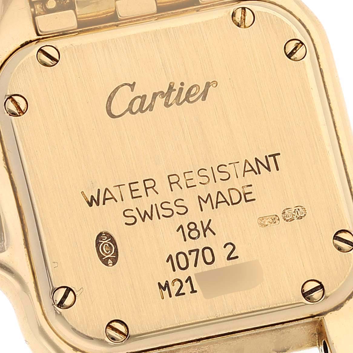 This image shows the back case of a Cartier Panthere W25022B9 Women's Yellow Gold Silver Dial W25022B9 Women's Yellow Gold Silver Dial watch, displaying engravings and screws.