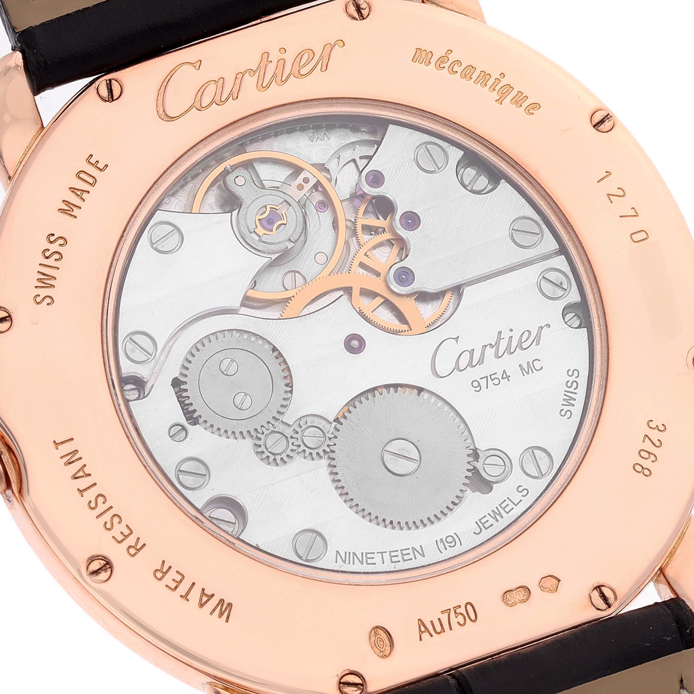This image shows the back view of a Cartier Ronde WR007001 Men's Rose Gold Silver Dial WR007001 Men's Rose Gold Silver Dial watch, highlighting its inner mechanical movement and inscriptions.