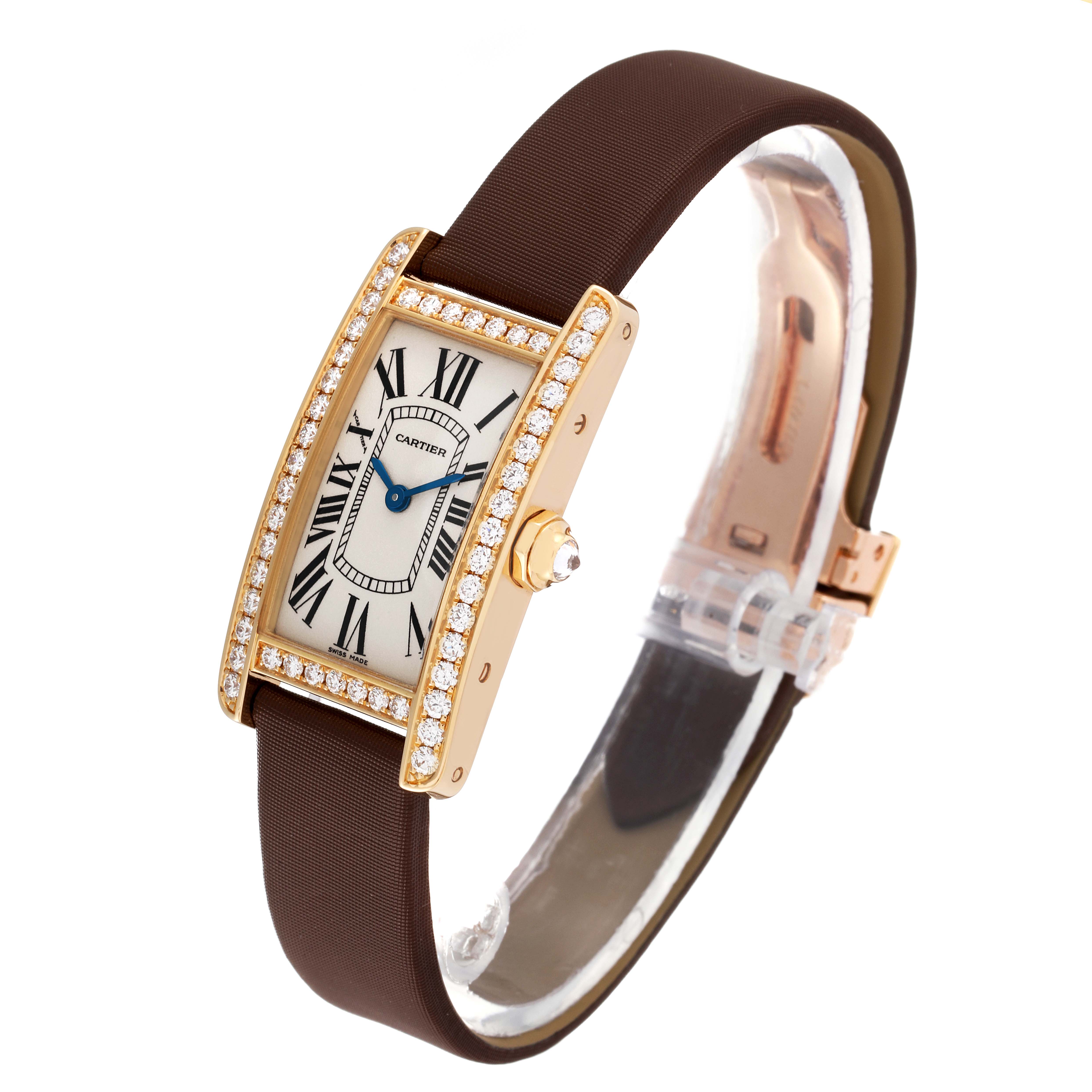 The image shows a Cartier Tank Americaine WB707231 Women's Yellow Gold Silver Dial WB707231 Women's Yellow Gold Silver Dial watch viewed from an angled perspective, highlighting its face, bezel, and strap.