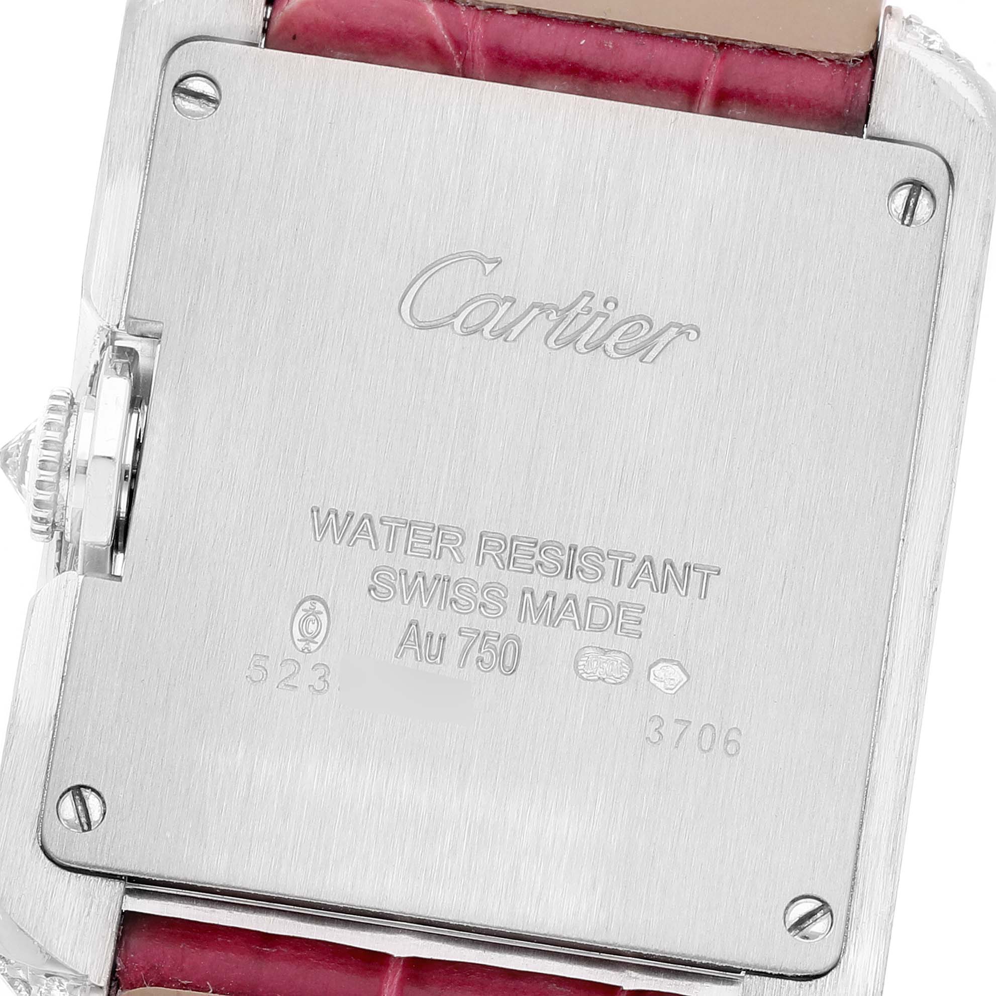 This image shows the back case of the Cartier Tank Anglaise WT100030 Women's White Gold Silver Dial WT100030 Women's White Gold Silver Dial watch with engravings and a part of the strap.