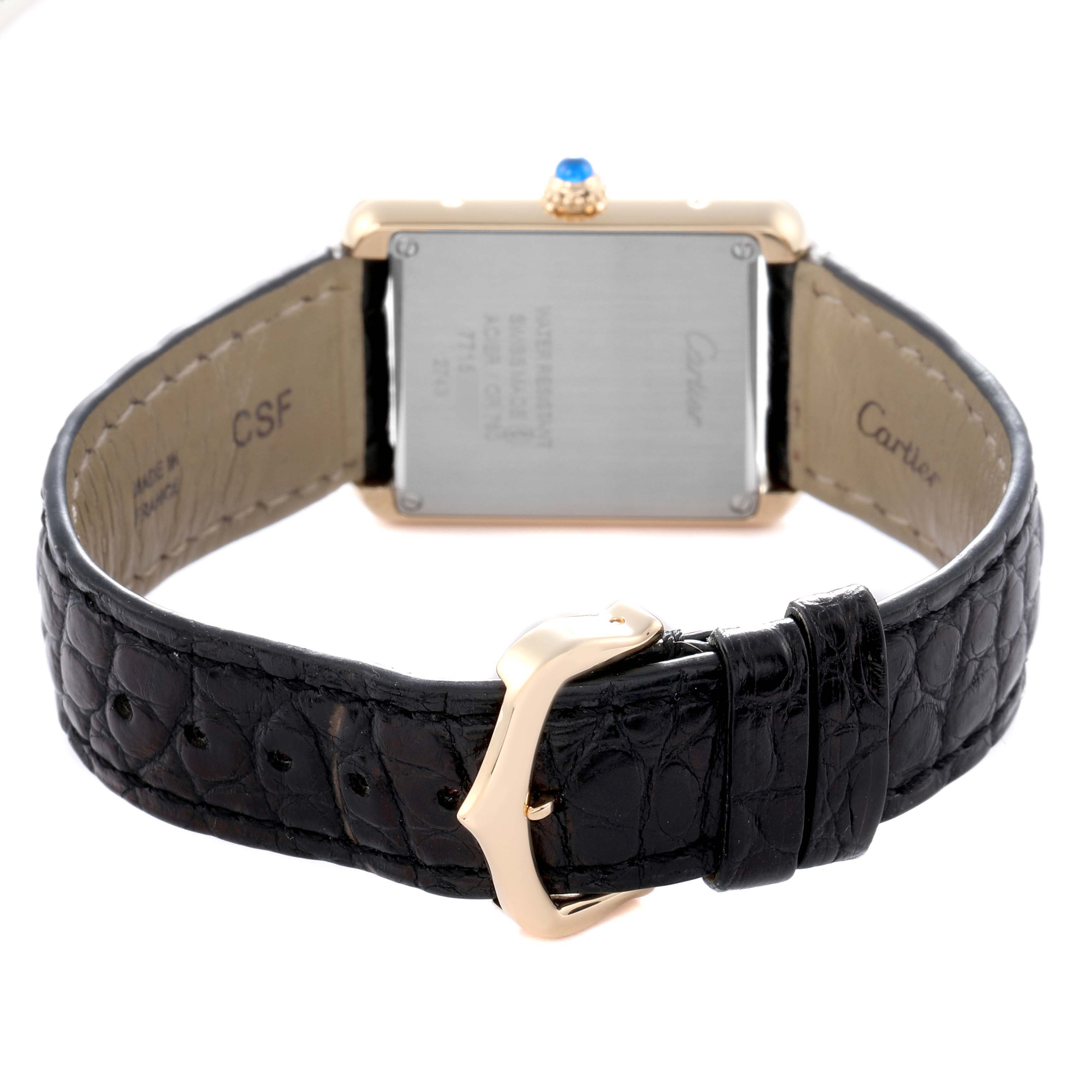 The image shows the Cartier Tank Solo model W1018755, men's watch, from the back, highlighting the rear case, leather strap, and a gold-colored buckle.