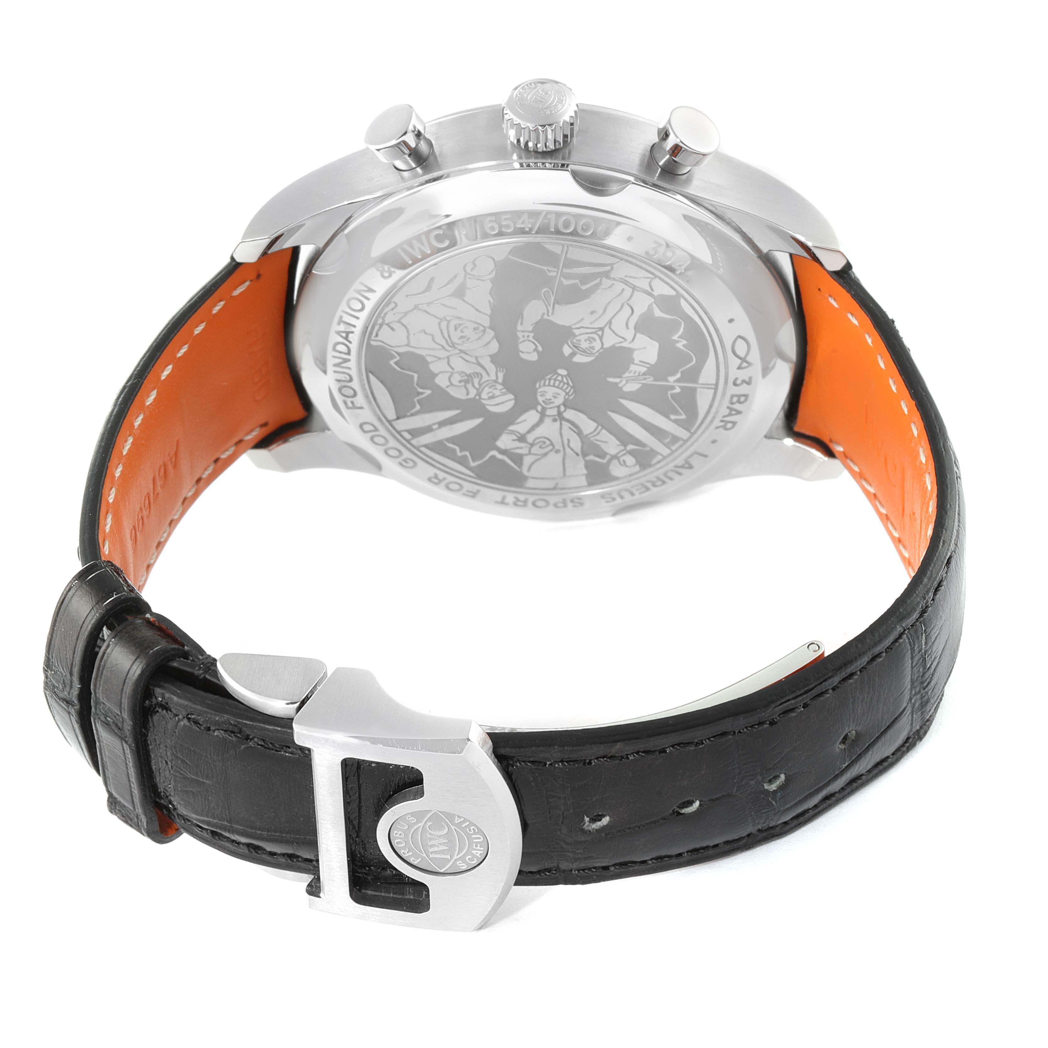 The image shows the back of the IWC Portuguese IW390406 men's watch, highlighting the engraved case back, crown, pushers, and part of the strap with the clasp.