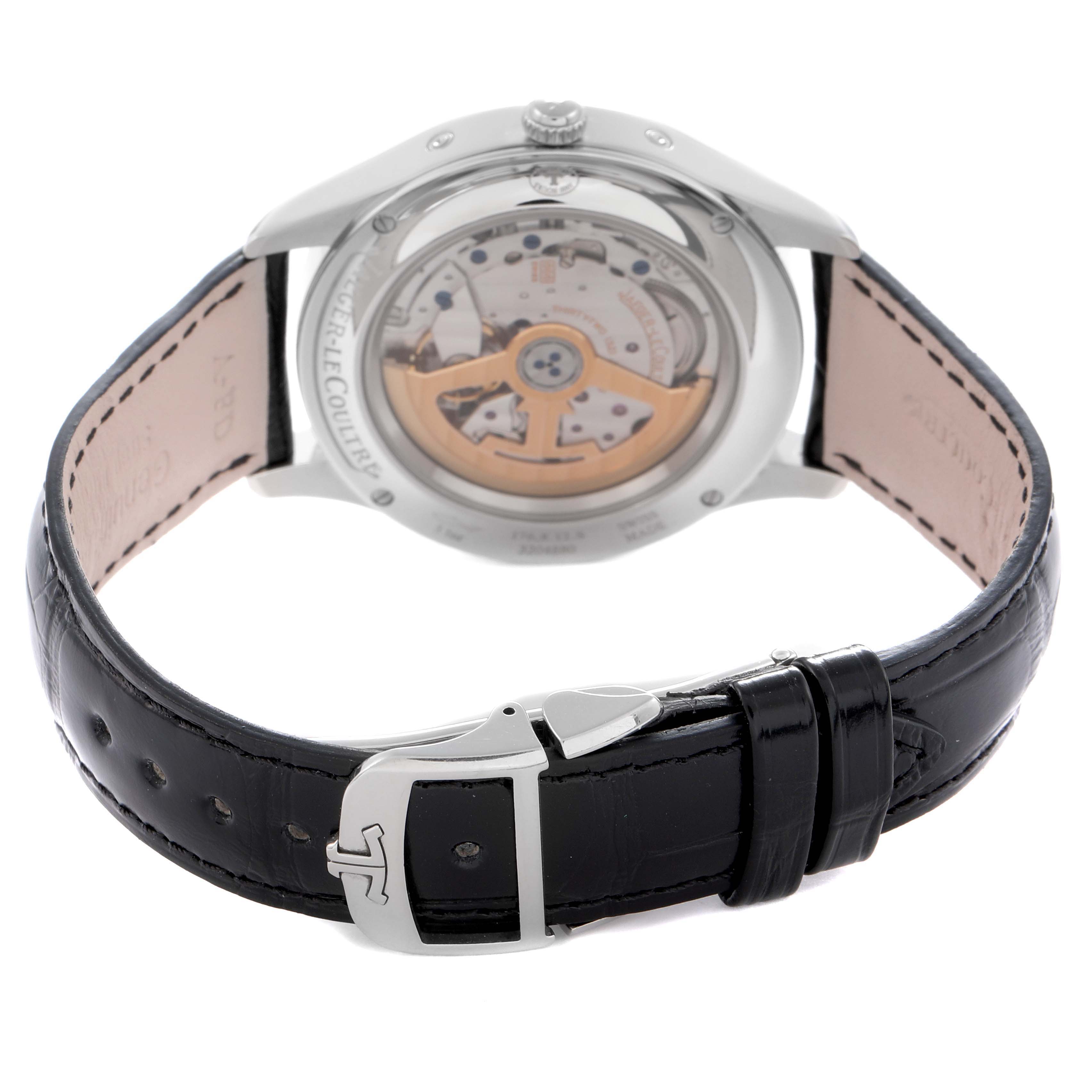 The image shows the back view of the Jaeger LeCoultre Master model Q1558421, displaying its movement through a transparent case back and the leather strap with buckle.
