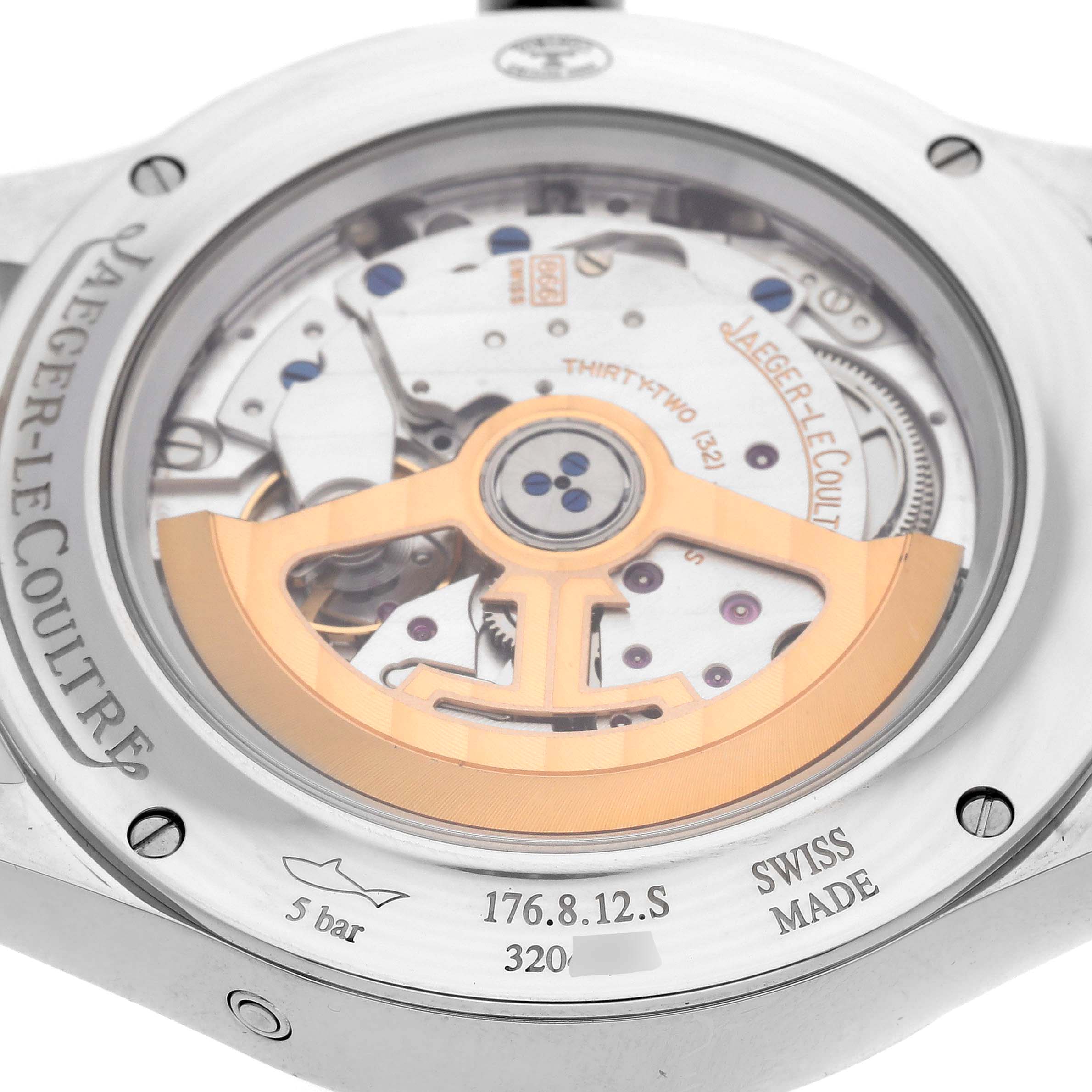 The image shows the back view of a Jaeger LeCoultre Master model Q1558421, highlighting its mechanical movement and rotor visible through the transparent case back.