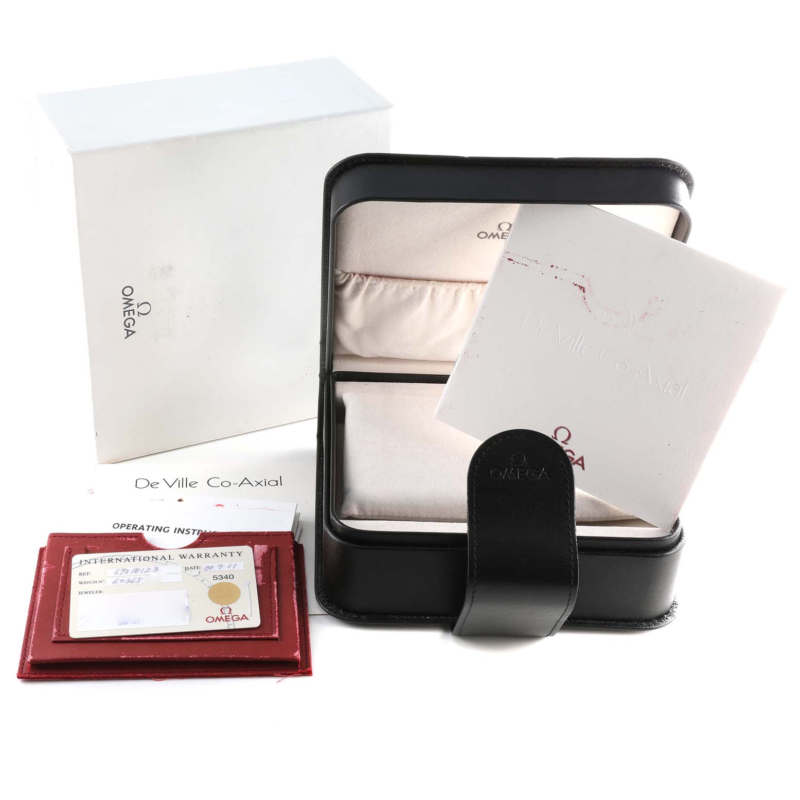 The image shows the Omega De Ville 5931.81.23 Men's Rose Gold Blue Dial 5931.81.23 Men's Rose Gold Blue Dial watch's box, warranty card, operating instructions, and white outer packaging.