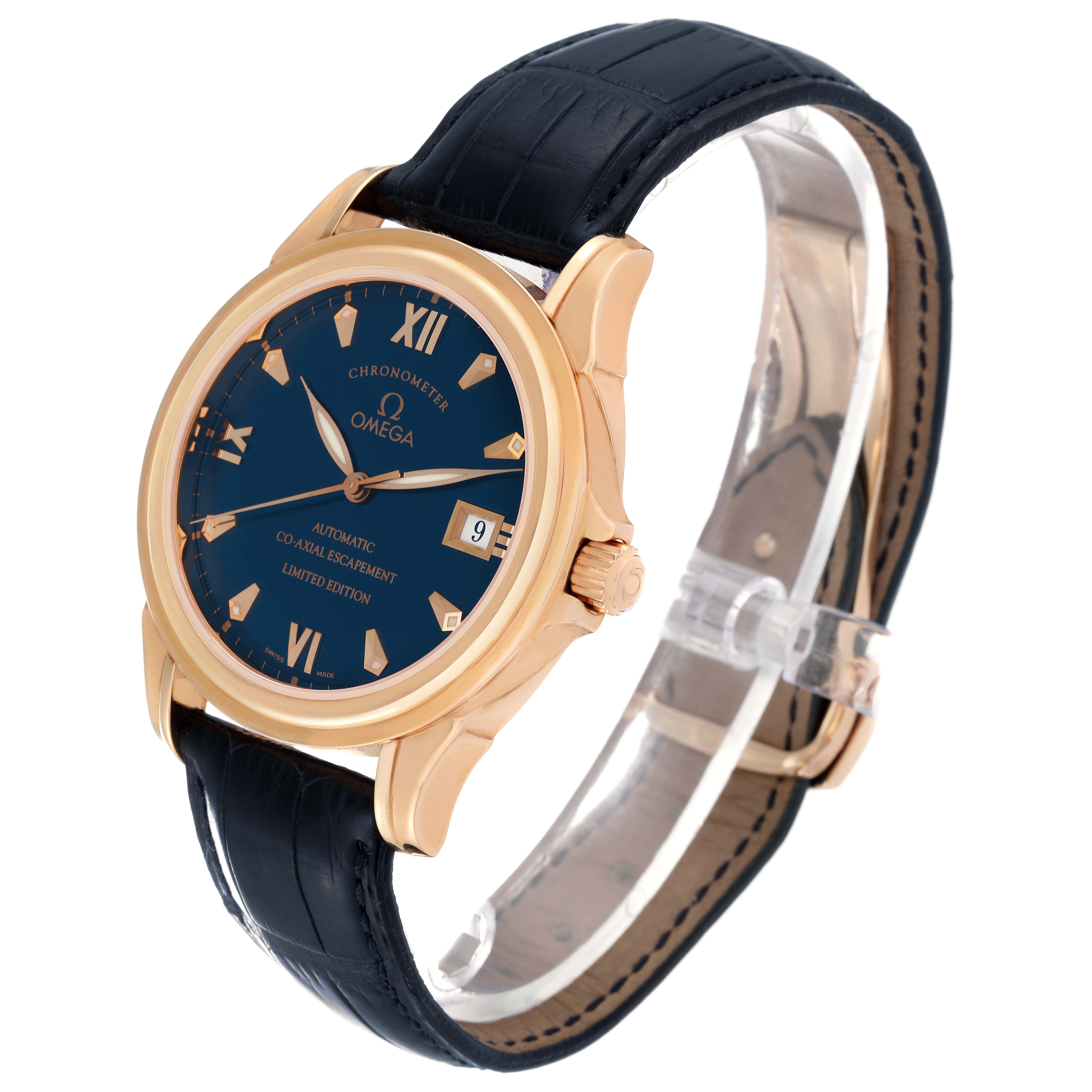 The Omega De Ville 5931.81.23 Men's Rose Gold Blue Dial 5931.81.23 Men's Rose Gold Blue Dial watch is shown at a three-quarter angle, highlighting its gold case, blue dial, and black leather strap.