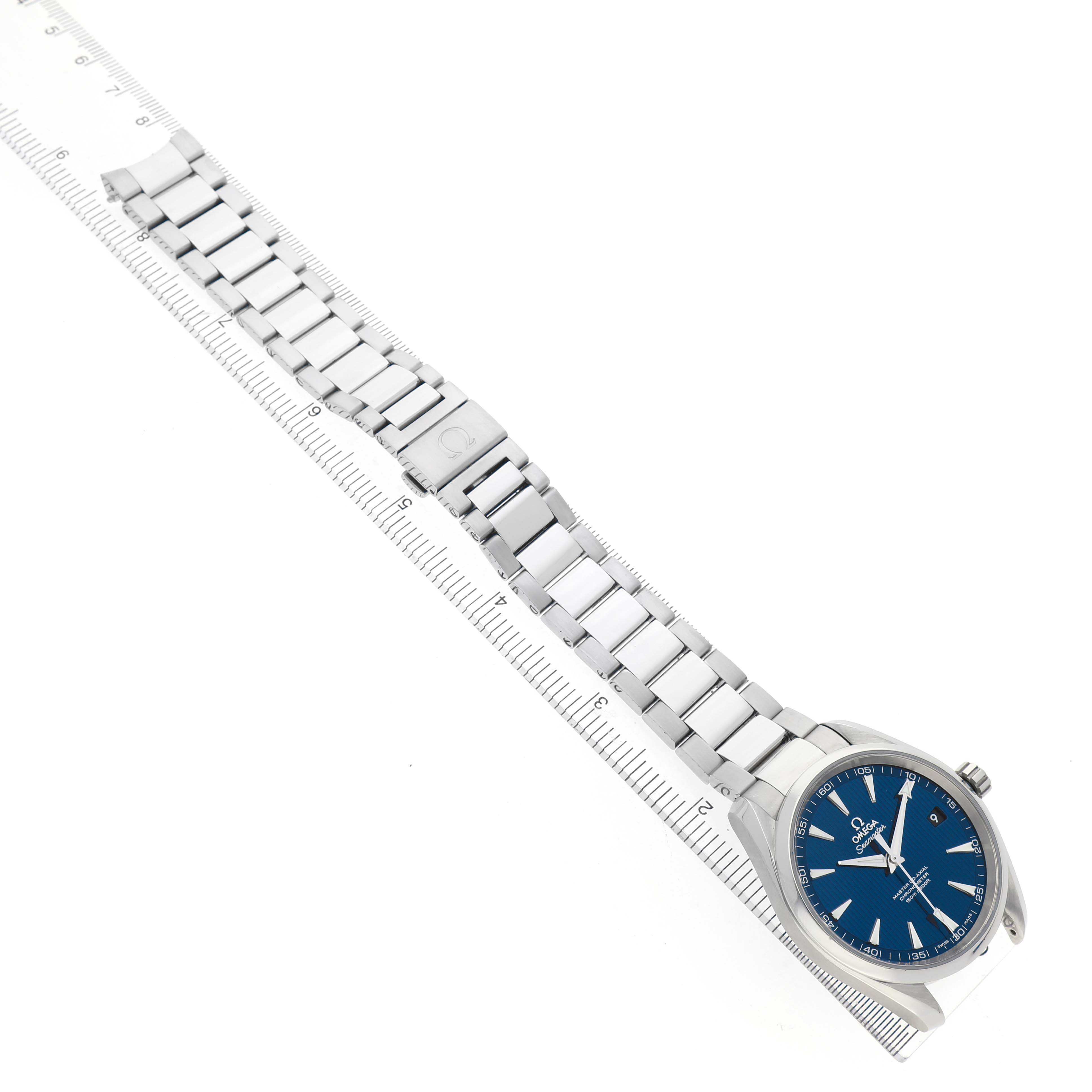 The Omega Aqua Terra 231.10.42.21.03.003 Men's Stainless Steel Blue Dial watch is shown diagonally with a full view of the face, case, and bracelet, alongside a ruler for scale.