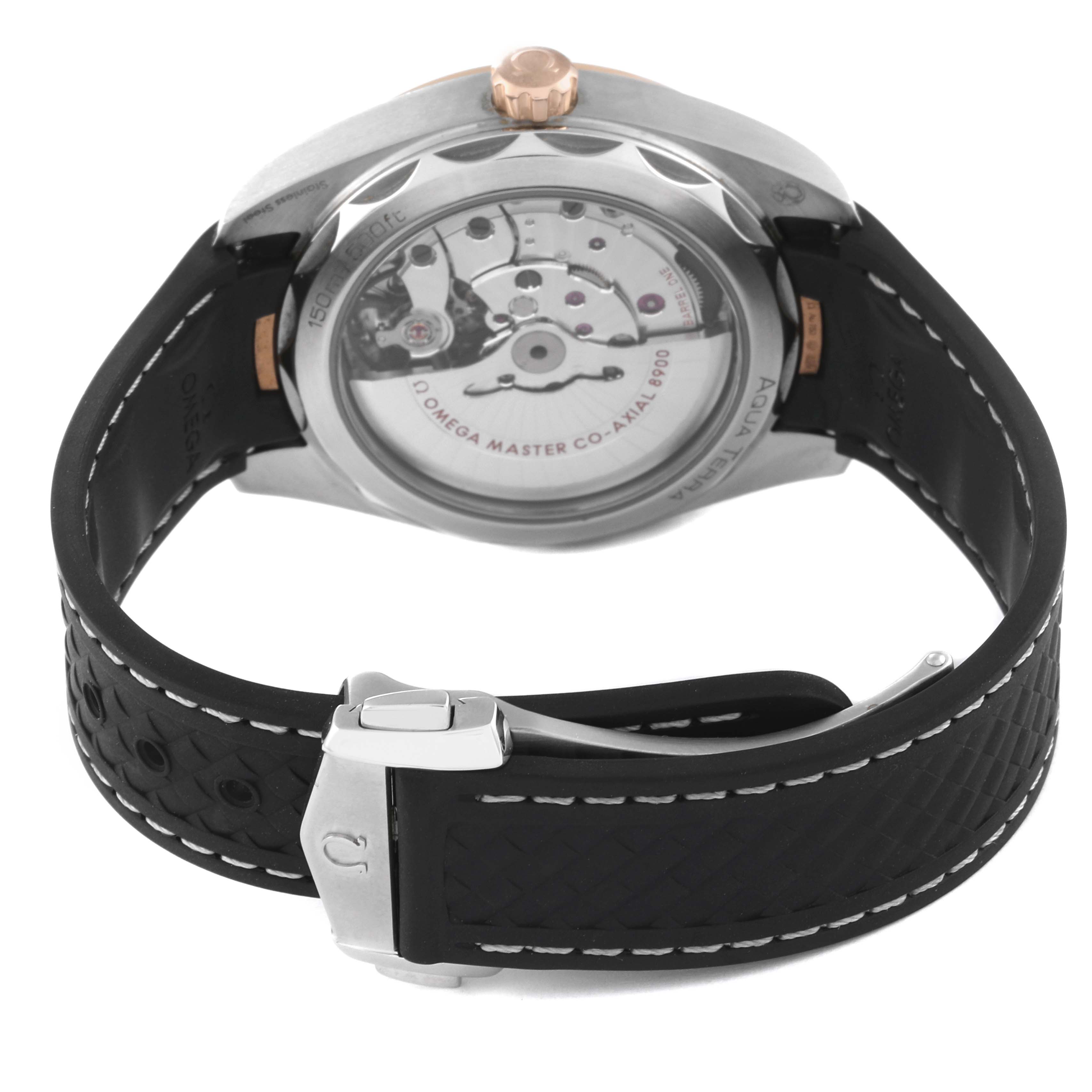 The image shows the back and strap of an Omega Aqua Terra 220.22.41.21.02.001 Men's Steel and Gold (two tone) Silver Dial 220.22.41.21.02.001 Men's Steel and Gold (two tone) Silver Dial watch, highlighting the movement mechanism and clasp.