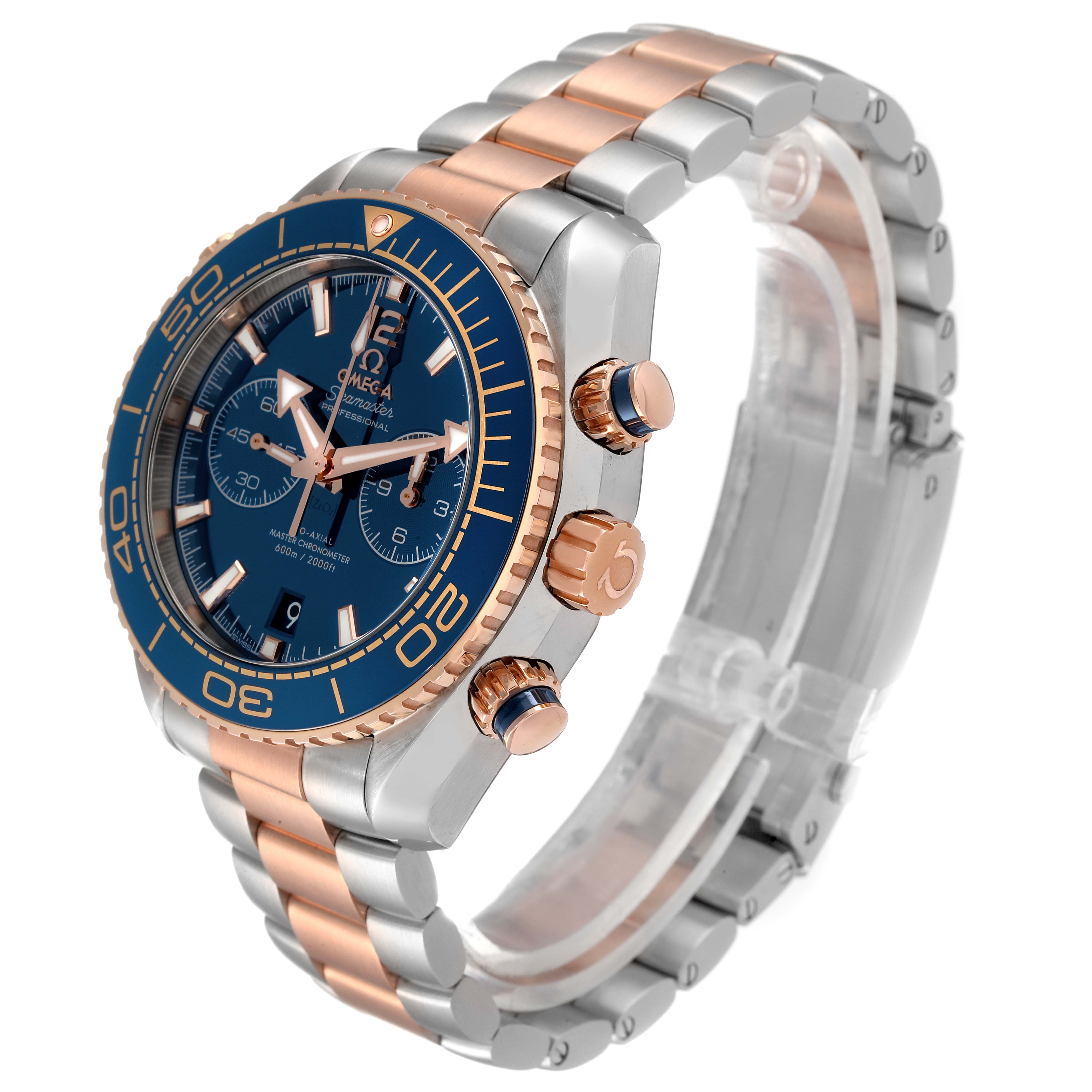 The image shows an Omega Planet Ocean 215.20.46.51.03.001 Men's Steel and Gold (two tone) Blue Dial 215.20.46.51.03.001 Men's Steel and Gold (two tone) Blue Dial watch at a three-quarter angle, highlighting its face, bezel, crown, and bracelet.