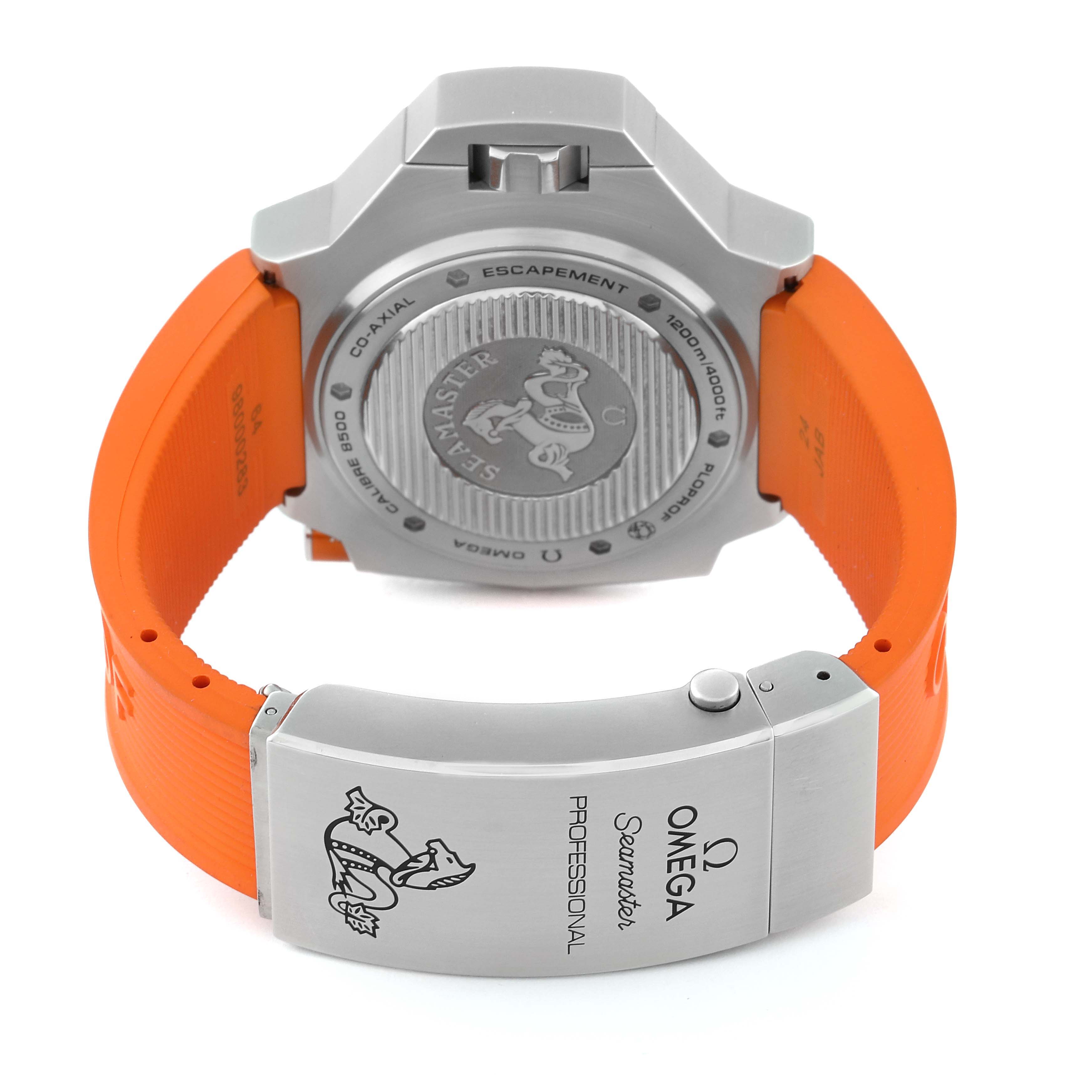 The image shows the back of an Omega Seamaster Ploprof watch, highlighting the case back and the orange strap.
