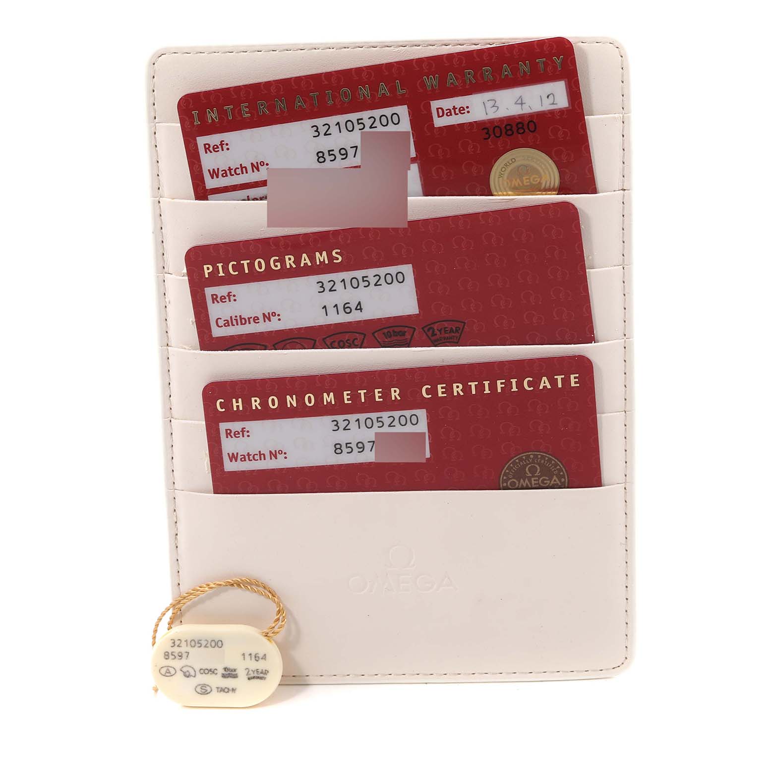 This image shows Omega Speedmaster 3210.52.00 Men
s Stainless Steel Black Dial 3210.52.00 Men
s Stainless Steel Black Dial accessories, including an international warranty, pictograms, chronometer certificate, and a tag.