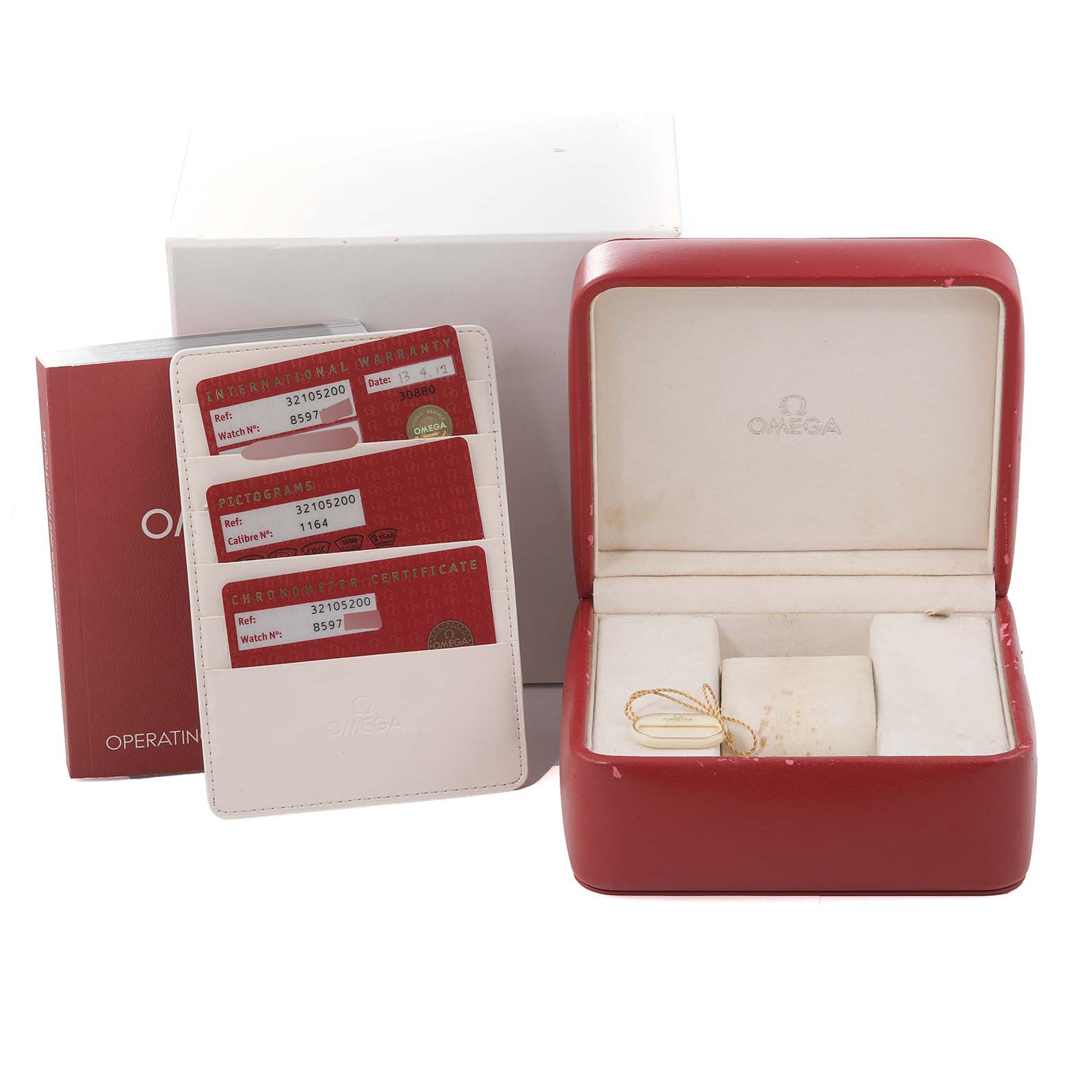 The image shows the Omega Speedmaster 3210.52.00 Men
s Stainless Steel Black Dial 3210.52.00 Men
s Stainless Steel Black Dial watch box, warranty cards, and an operating manual.