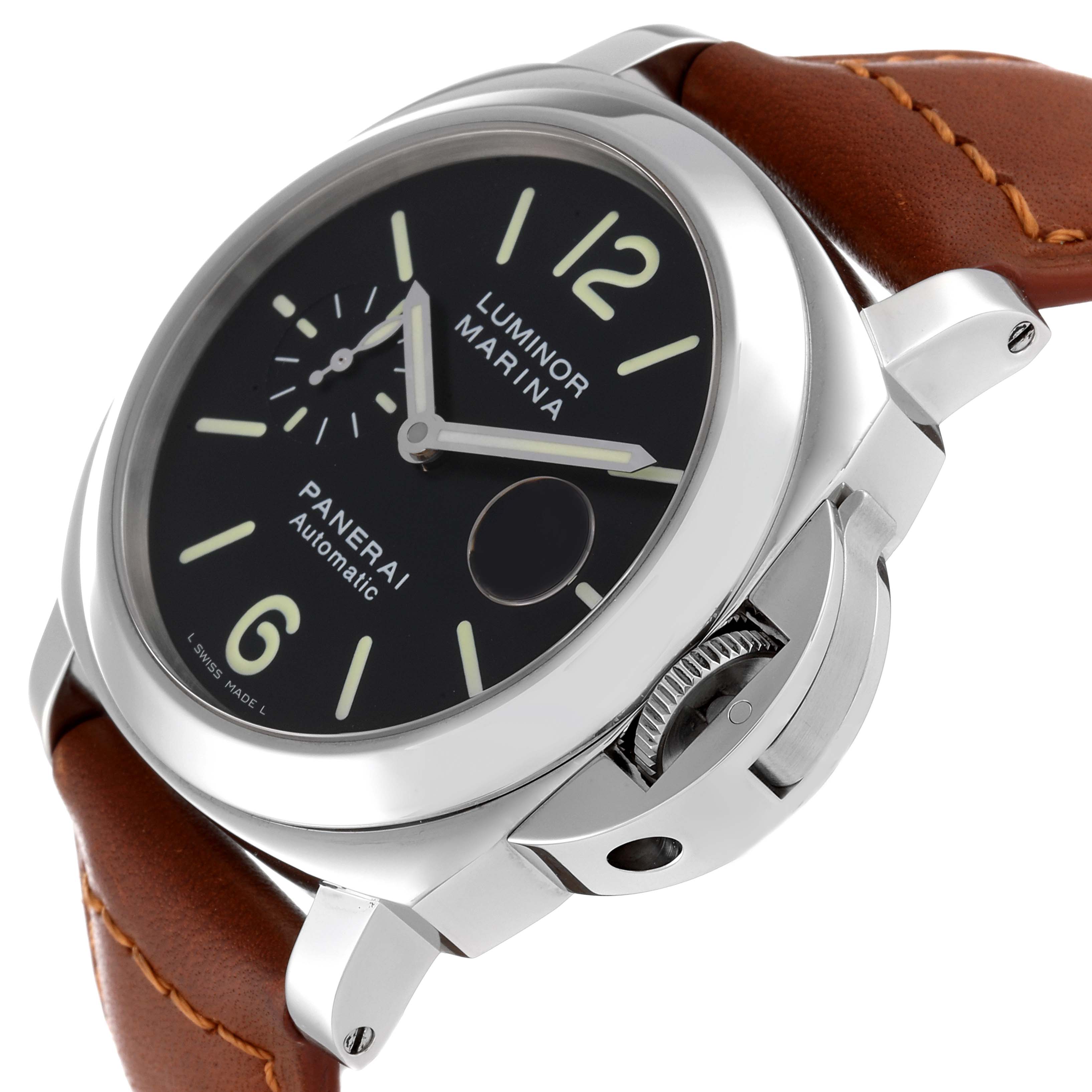The image shows a Panerai Luminor PAM00104 Men
s Stainless Steel Black Dial PAM00104 Men
s Stainless Steel Black Dial Marina watch from an angled close-up, highlighting its dial, crown, and leather strap.