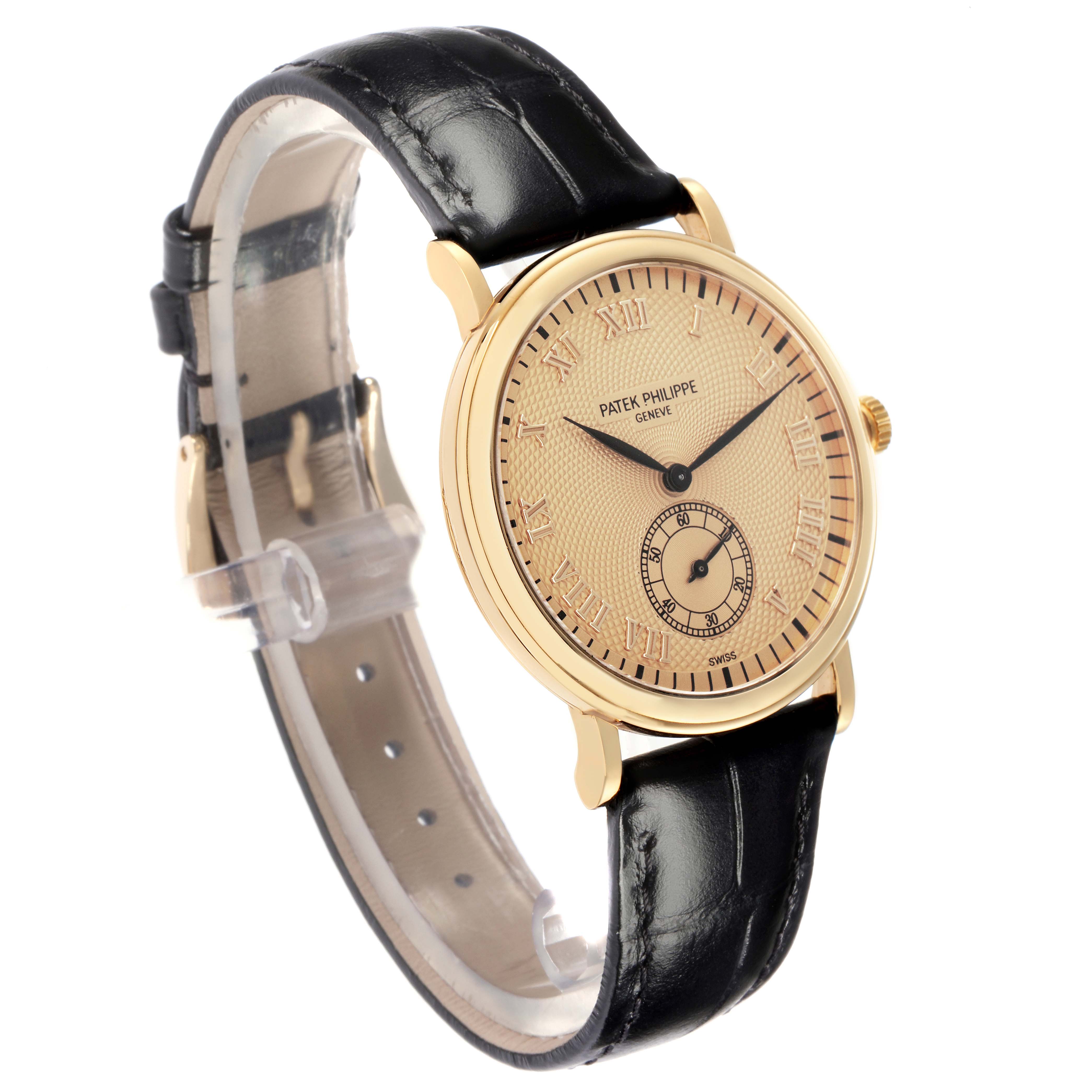 The Patek Philippe Calatrava 5022J-001 watch is shown at a three-quarter angle, highlighting its dial, leather strap, and gold case.