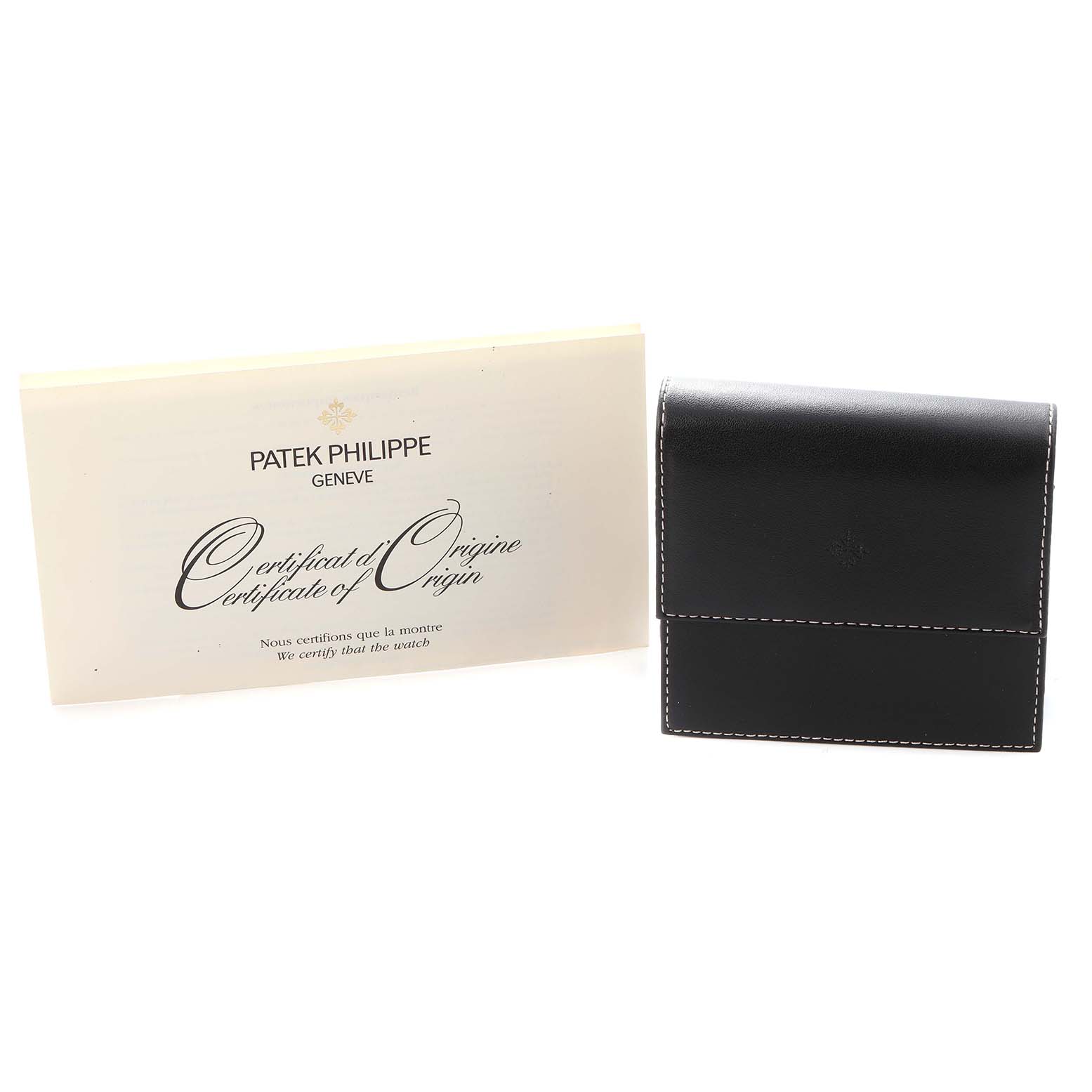 The image shows a certificate of origin and a black leather case for the Patek Philippe Calatrava, model number 5022J-001.