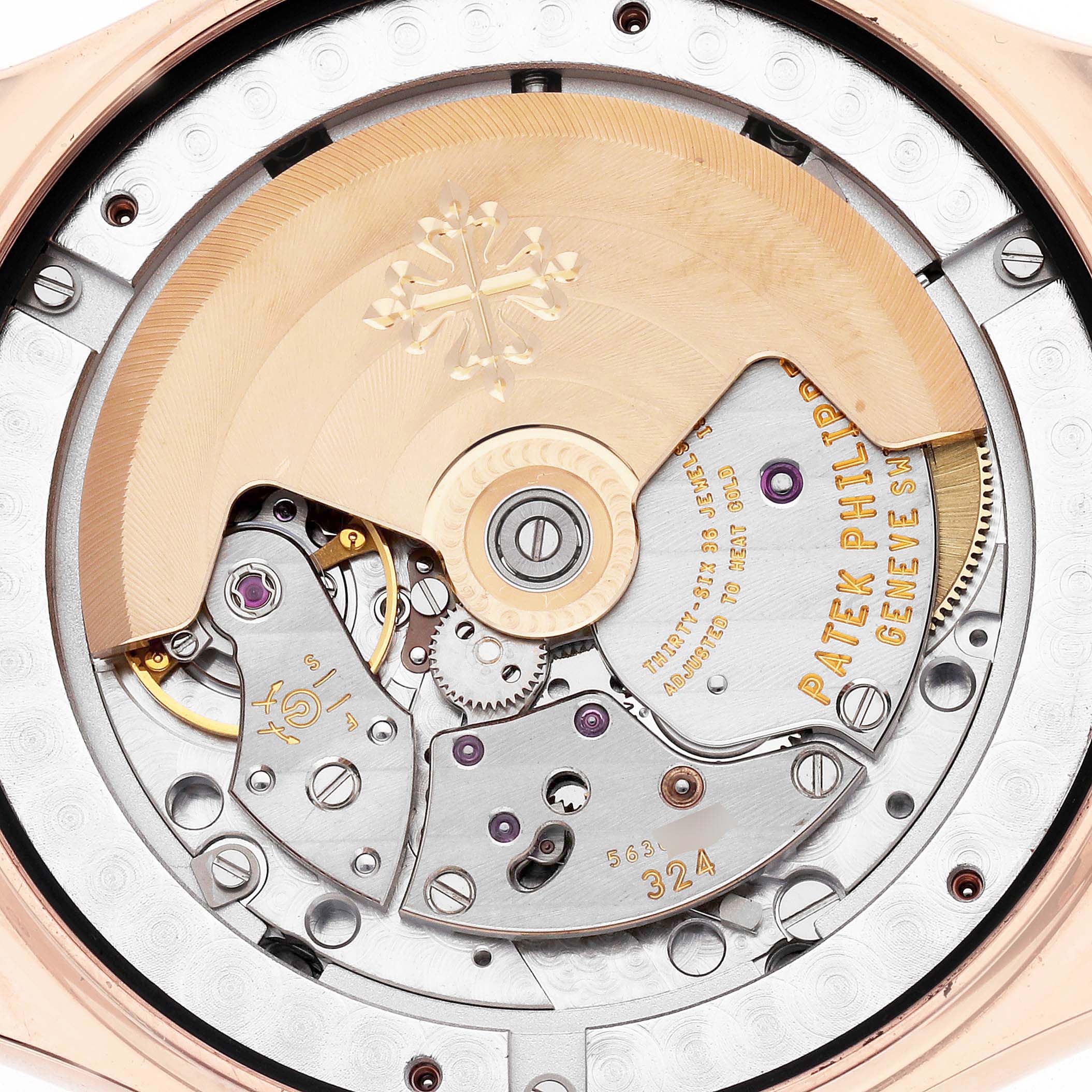 The image shows a close-up of the movement of the Patek Philippe Complications 5146R men's watch, highlighting the intricate mechanical components.
