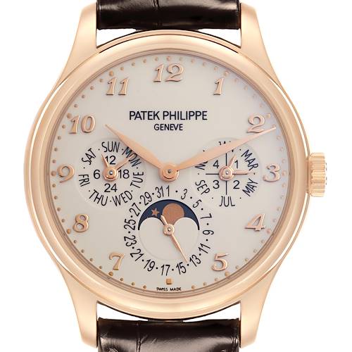 The Patek Philippe Complications 5327R watch is shown from a front angle, displaying its dial, hands, and moonphase feature, with a visible leather strap and crown.