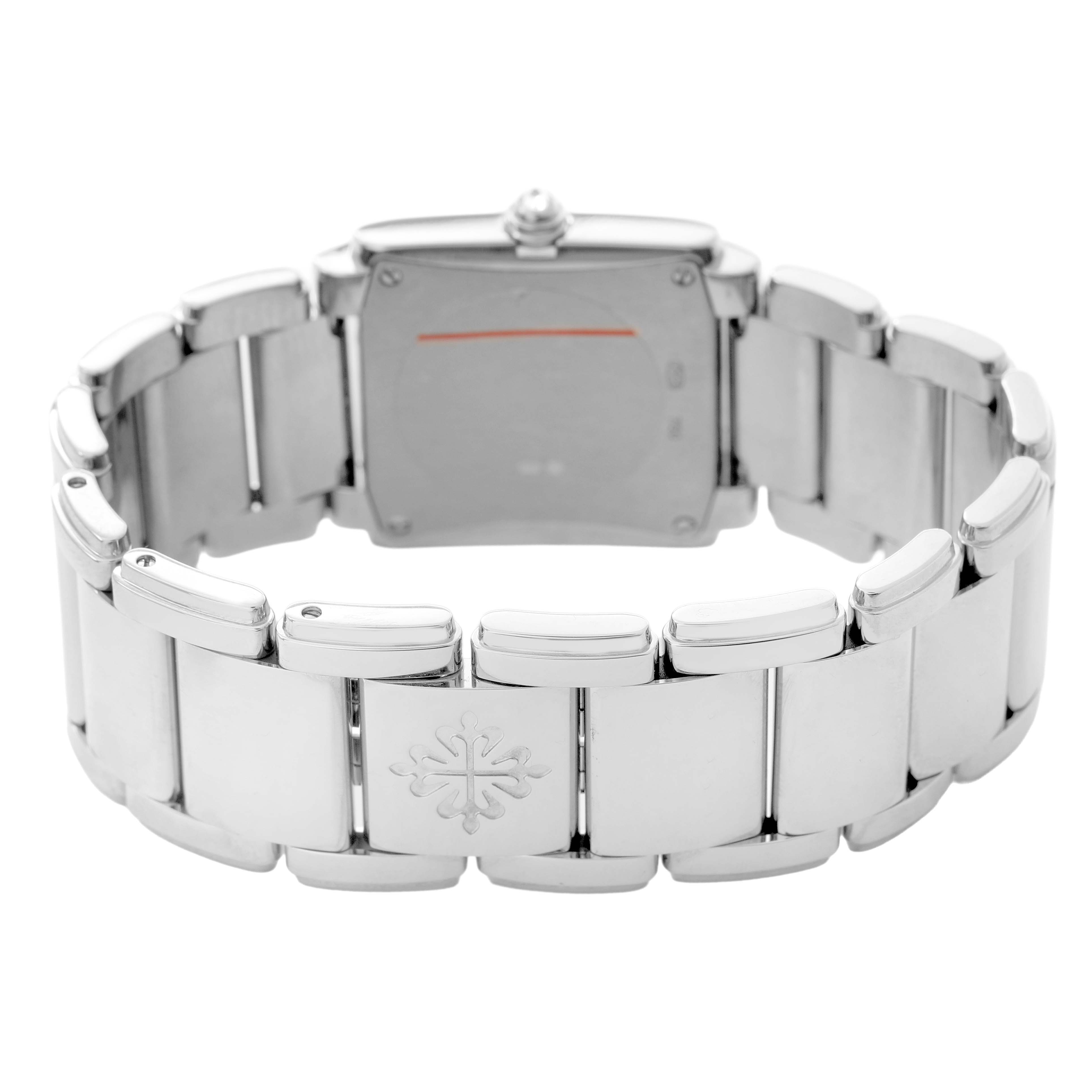 The image shows the back of the Patek Philippe Twenty-4 4910/20G-001 Women's White Gold Black Dial watch, highlighting the bracelet and clasp.