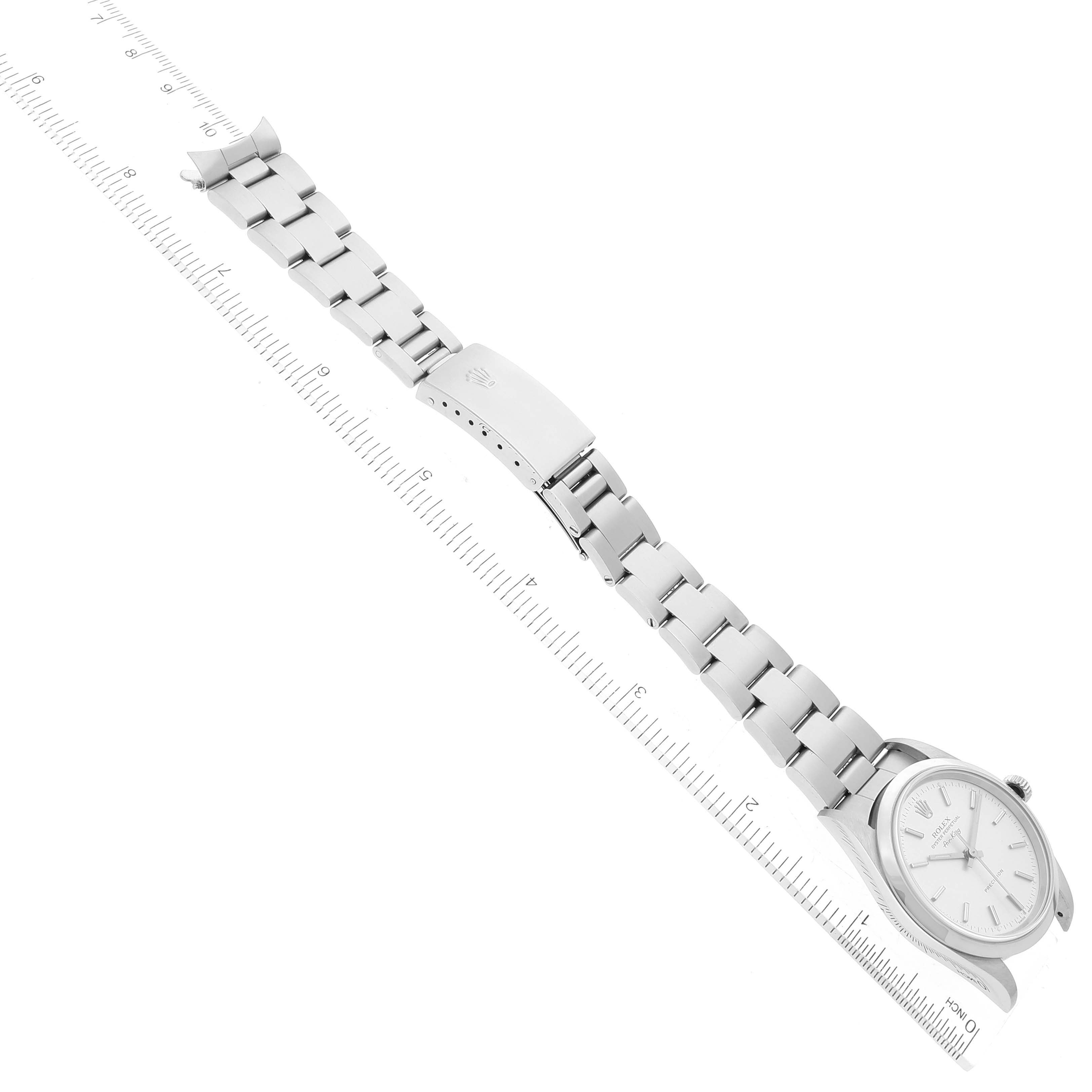 The image shows a top view of a Rolex Air-King 14000 Men's Stainless Steel Silver Dial 14000 Men's Stainless Steel Silver Dial watch, including the face, bracelet, and clasp, with a ruler for scale.