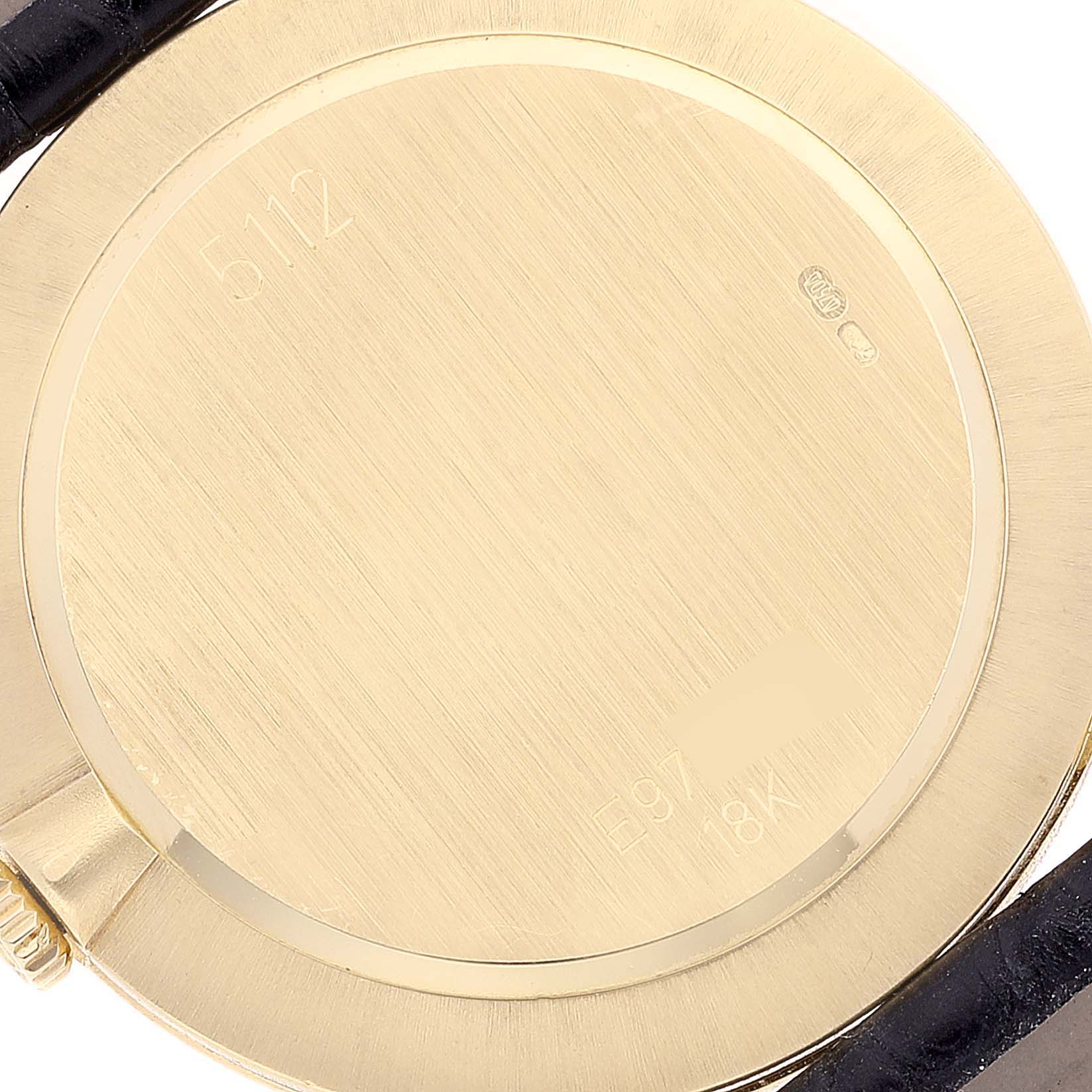 The image shows the back case of a Rolex Cellini 5112 Women's Yellow Gold Mother of Pearl Dial 5112 Women's Yellow Gold Mother of Pearl Dial watch, focusing on its gold finish and engraved details.