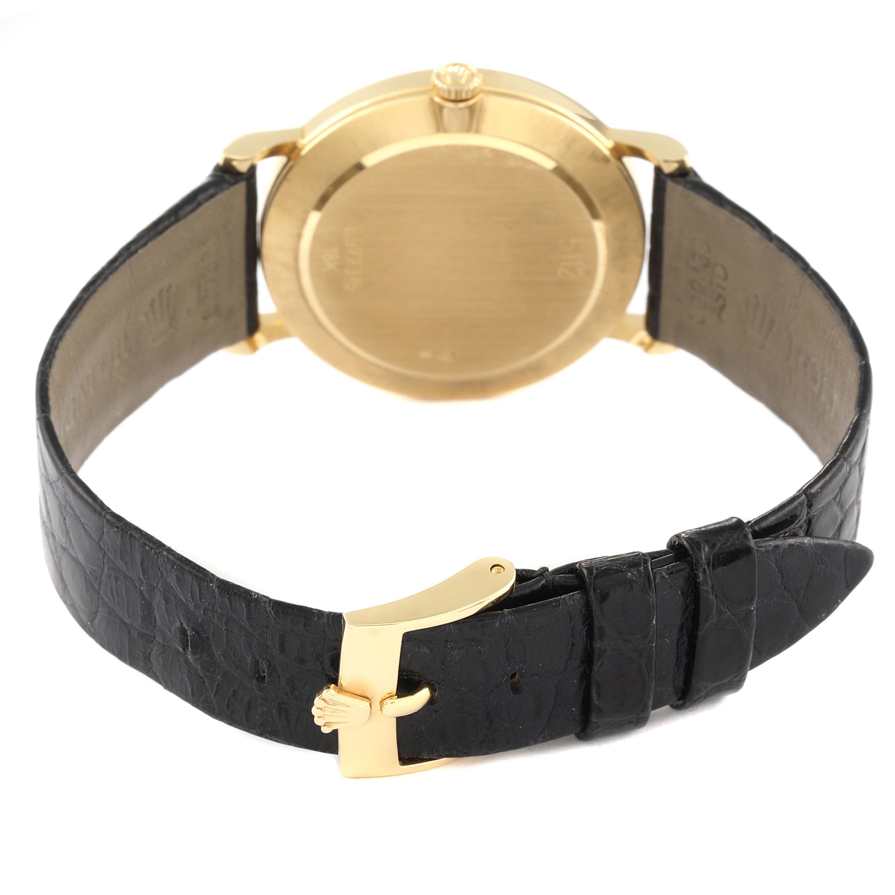 The image shows the back view of a Rolex Cellini 5112 Women's Yellow Gold Mother of Pearl Dial 5112 Women's Yellow Gold Mother of Pearl Dial watch, displaying the case back and black leather strap with a gold clasp.