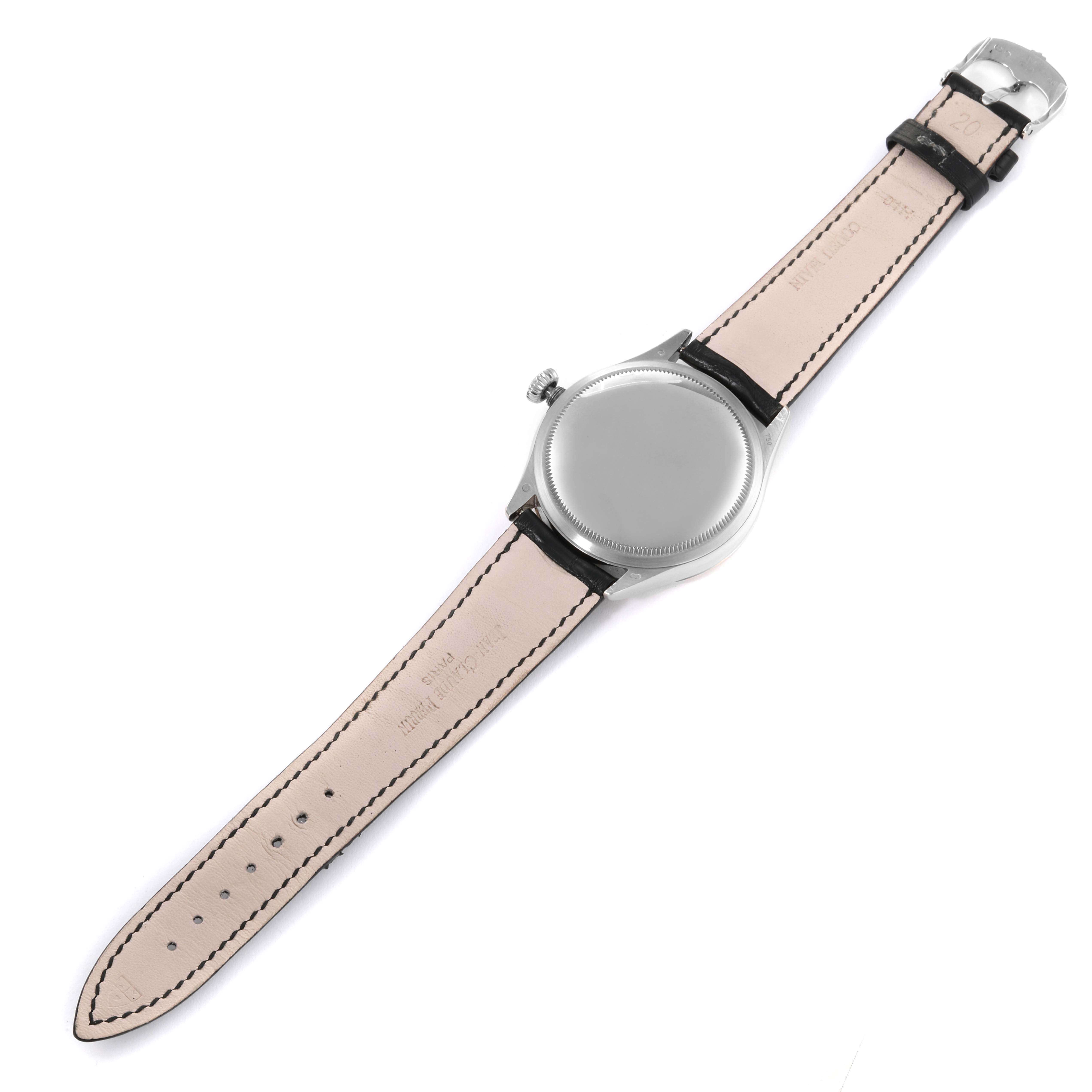 The image shows the back of a Rolex Cellini 50509 Men's White Gold Silver Dial 50509 Men's White Gold Silver Dial watch laid flat, displaying its silver case and leather strap.