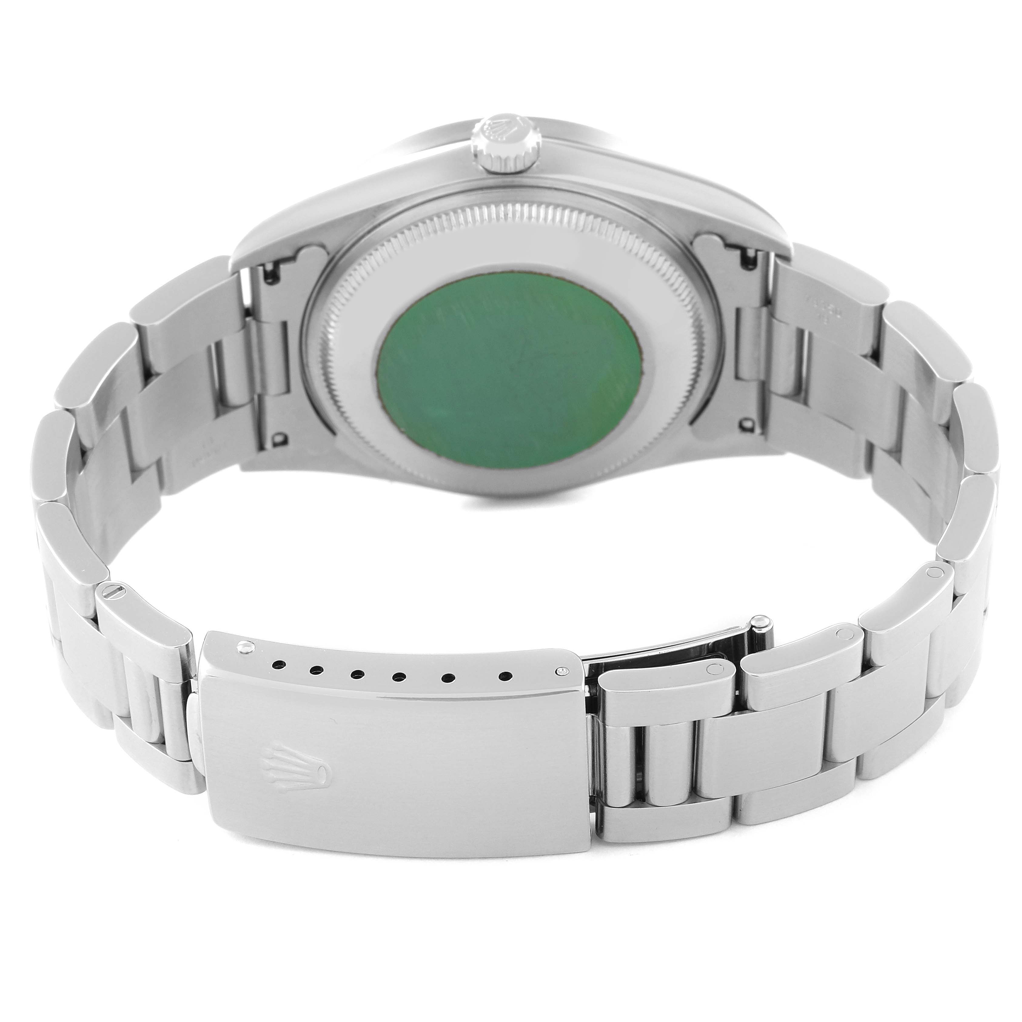 This image shows the back case and stainless steel bracelet clasp of a Rolex Date 15210 Men's Stainless Steel Silver Dial 15210 Men's Stainless Steel Silver Dial model watch.