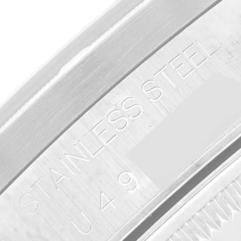 This close-up shows the side of the stainless steel case of a Rolex Date 15210 Men's Stainless Steel Silver Dial 15210 Men's Stainless Steel Silver Dial model watch.