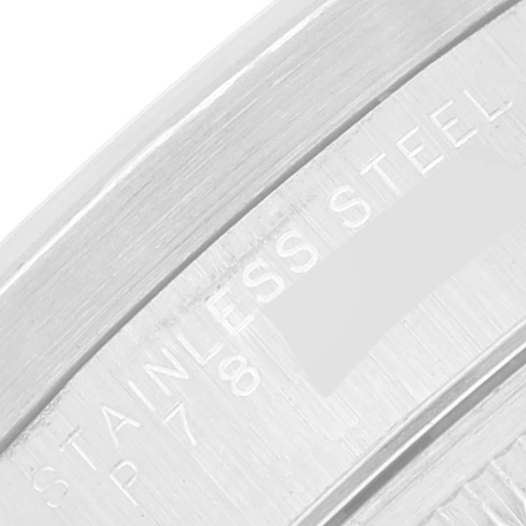 The image shows a close-up of the stainless steel case back of a Rolex Date 15210 Men's Stainless Steel White Dial 15210 Men's Stainless Steel White Dial model.