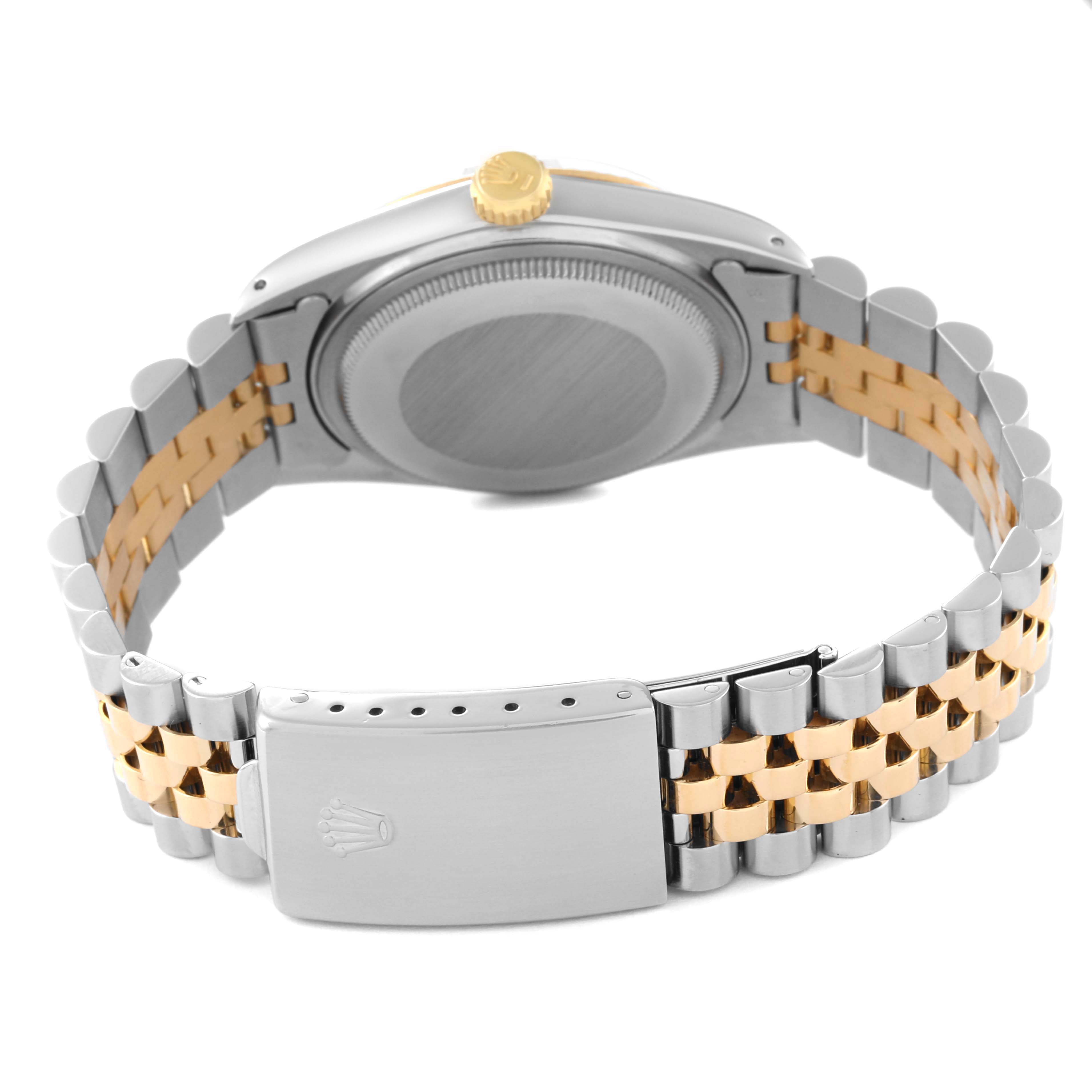 The image shows the back view of a Rolex Vintage Collection 16013 Men's Steel and Gold (two tone) Champagne Dial 16013 Men's Steel and Gold (two tone) Champagne Dial watch, highlighting its bracelet and clasp.