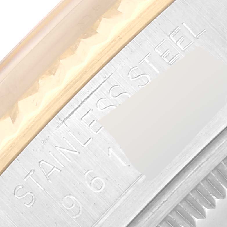 This image shows a close-up of the case side of the Vintage Collection model by Rolex, highlighting the bezel and inscription.